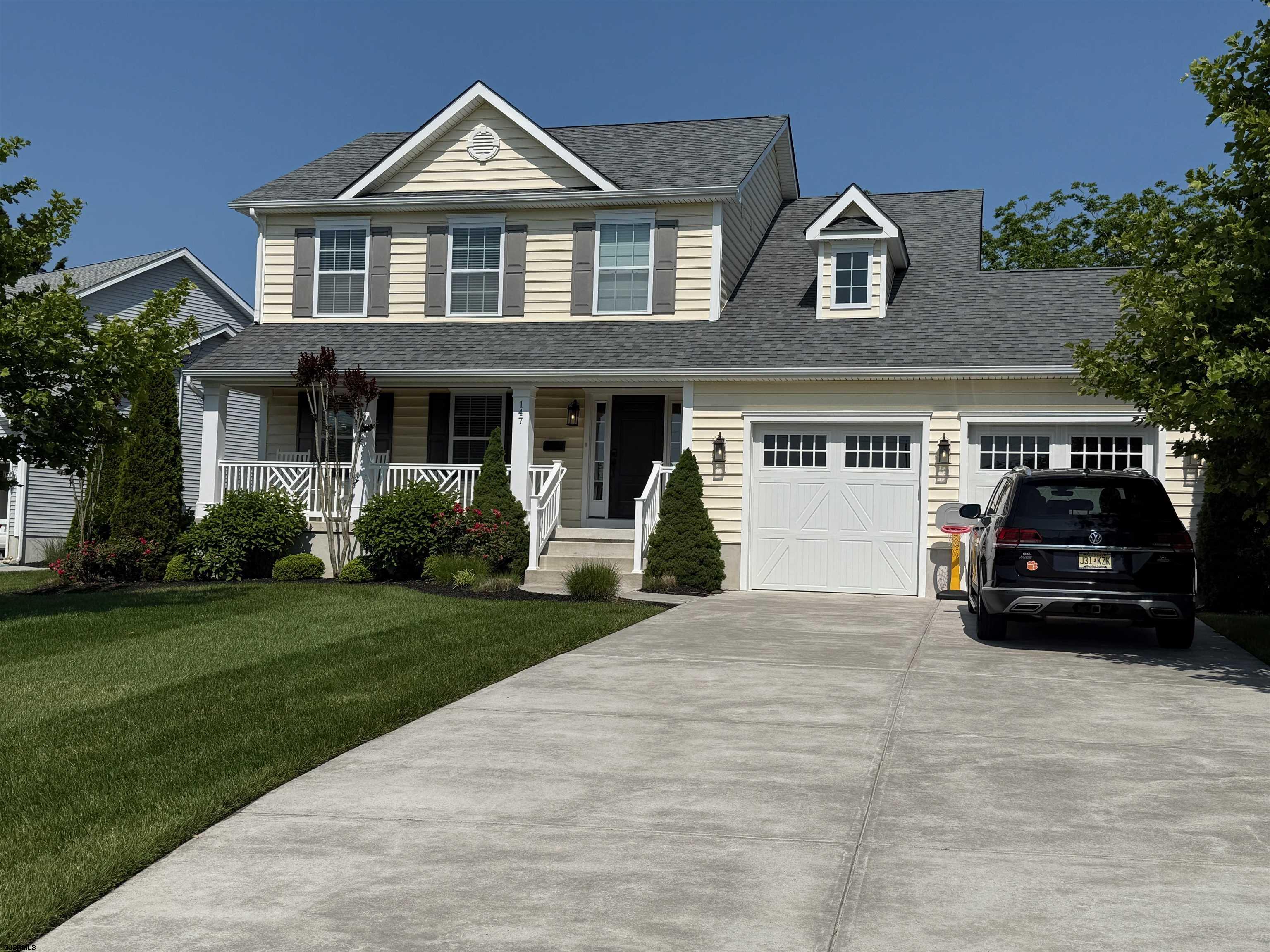 Welcome to this 2,000 square foot custom-built home perfectly positioned on a corner lot next to the prestigious Atlantic City Country Club. Enjoy sweeping views of the driving range, the Margate Bridge, and the stunning skyline. The welcoming covered porch has composite planks and on the ceiling has wood detail. Step inside this home to see what it offers. An open concept kitchen flows seamlessly into the dining area, and into the living room, perfect for entertaining.  Upstairs there are 4 spacious and bright bedrooms including the Master Bedroom suite with walk in closet, vaulted ceilings. This home also boast 3 bathrooms and 1 half bath, 2 car garage with EV charger installed, large pantry, and a fully finished basement with a FULL bathroom, providing plenty of space for family and guests. Enjoy a beautifully designed backyard featuring a custom fire pit with built-in seating surrounded by pavers, ideal for cozy evenings or summer BBQs. An additional shed provides extra storage for beach gear or lawn tools.  Located just a short drive from Margate, Ventnor, Atlantic City, and Ocean City, this home combines comfort, convenience, and coastal living in one perfect package.