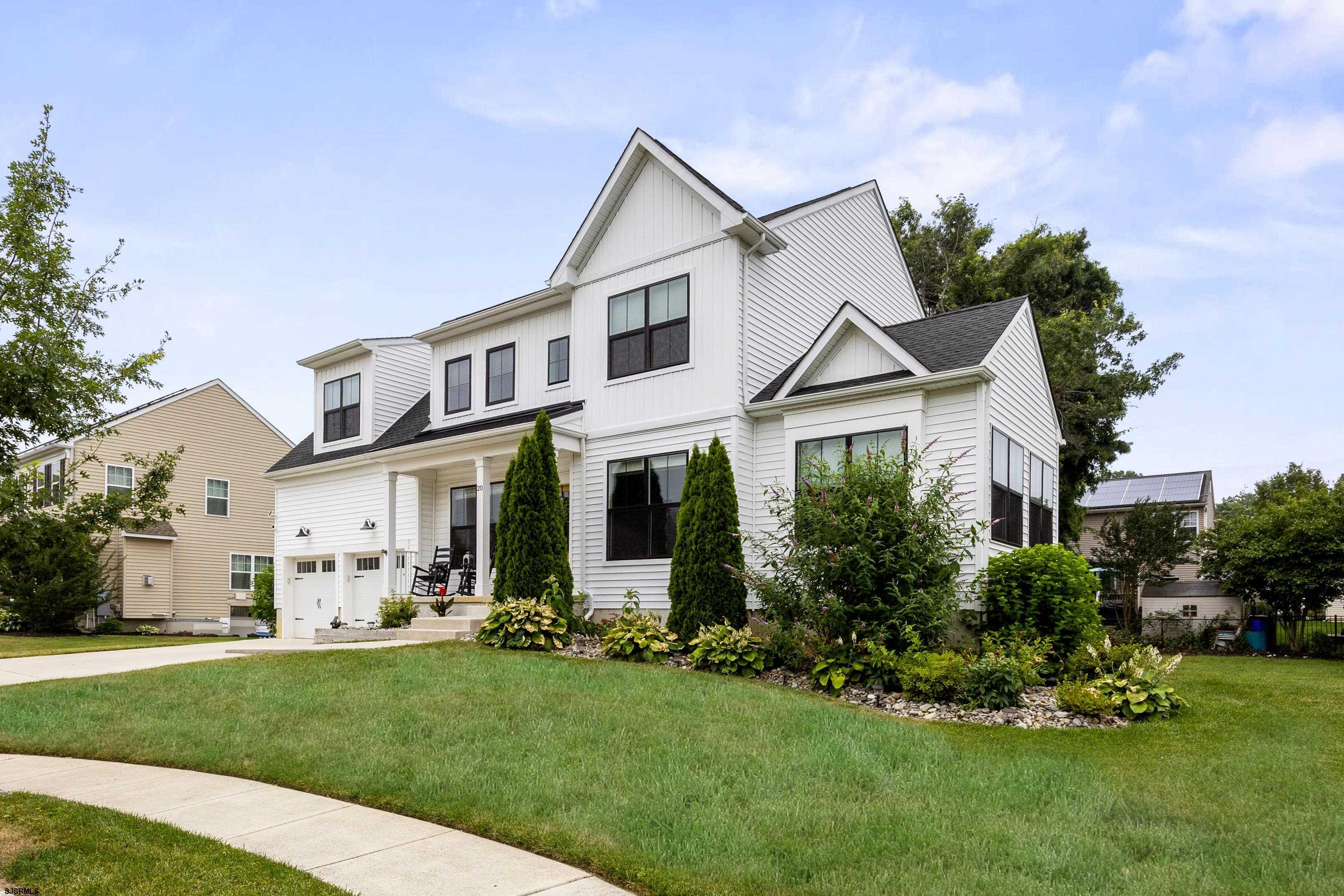A Very Motivated Seller and a huge price adjustment for this beautiful 5 year young beautiful Hampton Model within the highly desired  development of Glen Eyre.  The contemporary elevation is designed with a beautiful open floor plan that reflects what today’s homebuyers truly want. This stunning 4 bedroom / 2.5 bath home features a formal living room and dining room, each adorned by the elegant hardwood flooring that spans throughout the first floor.  A bright and airy sunroom with a cathedral ceiling is drenched in light, the perfect space to relax or entertain  The gourmet kitchen is a chef’s dream, complete with 42" cabinets, quartz countertops, a center island, a farmhouse-style sink, and a pot filler conveniently located over the range. You'll also enjoy upgraded stainless steel appliances.  The great room is expansive and provides the fireplace, with a soaring ceiling and a floor to ceiling wall of windows, highlighting the dramatic elevation.  The convenient main floor laundry offers plenty of space and cabinetry for storage, and is set aside from the inside access of the large 2 car garage.  The main floor living is completed by a 2-piece powder room.  On the upper floor is a primary suite that is spacious with a tray ceiling, 2 closets including a large walk-in, sitting / dressing area and primary bath. This space offers the double vanity with granite counters and a sizable walk in shower, plus a private water closet.  Three spacious secondary bedrooms, ( one also includes its own walk-in!); and a three piece hall bathroom with tile surround and floors complete this level of the newer home!! The backyard is a perfect place for the summer BBQ’s and playtime as you enjoy the newer composite decking.  A full unfinished basement is waiting for the imagination of a new owner and is perfect for future expansion.  This home also offers smart, energy-efficient features like a tankless gas hot water heater, natural gas range, high-efficiency heating and cooling, and a "smart home" tech package — including a Wi-Fi-enabled doorbell, thermostat, keyless front entry, and low-voltage wiring for enhanced connectivity. A new home owner will benefit from the balance of the builder warranty. Convenient to the AC Expressway, Rt 40 for easy city to shore travel, and plenty of shopping this home will not last long!!