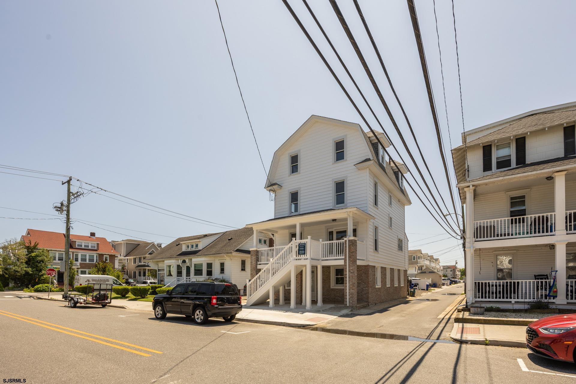 Charming, fully remodeled 5-bedroom, 4-bath home in Ocean City, featuring 3 levels of living space with 2 separate living areas, including a wet bar.