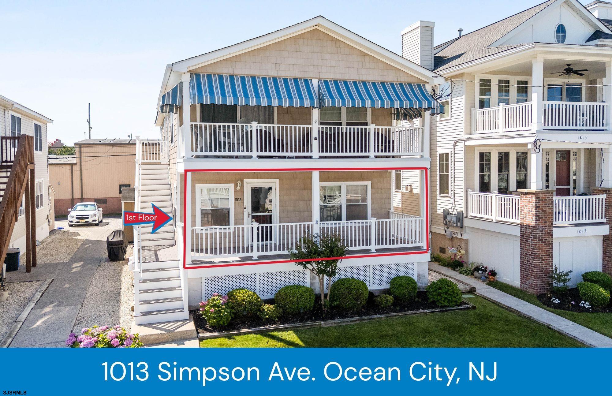 Welcome to 1013 Simpson Avenue — a solid opportunity in a desirable north end location to buy now & still enjoy the summer! Offering over 1,200 square feet with 3 bedrooms and 2 full baths, this first-floor condo has a lot to offer. The covered front porch is perfect for morning coffee, post-beach relaxing, or evening cocktails. Inside, the home has been freshly painted and features a clean, functional layout that’s easy to enjoy. You'll love the location—just a short walk to the beach and Playland’s Castaway Cove, a few blocks from the bay, and near the dining and shopping along Asbury Avenue. It’s a prime spot that offers convenience without the chaos of being in the thick of the summer crowds. The open floor plan includes a spacious living room and uplighting in the dining and kitchen areas. The kitchen features granite countertops, newly painted cabinetry, and a breakfast bar that connects seamlessly with the dining space. Down the hall, you’ll find utility closets, a full-size stackable washer and dryer, and two hall bedrooms served by a full bath. The primary suite is set toward the back of the unit and includes its own private bath. Parking is easily accessed from the rear alley, and the first-floor location means fewer steps and easier living. While the bedroom carpets and some windows could use updating, the home is priced accordingly—offering a chance to make it your own and build equity over time. Whether you're looking for a weekend getaway, investment property, or year-round residence, 1013 Simpson Ave delivers space, location, and potential in a great location.   **Outdoor Shower, Light Brown Bike Shed, & Shed belong to 2nd floor.  Please do not open**