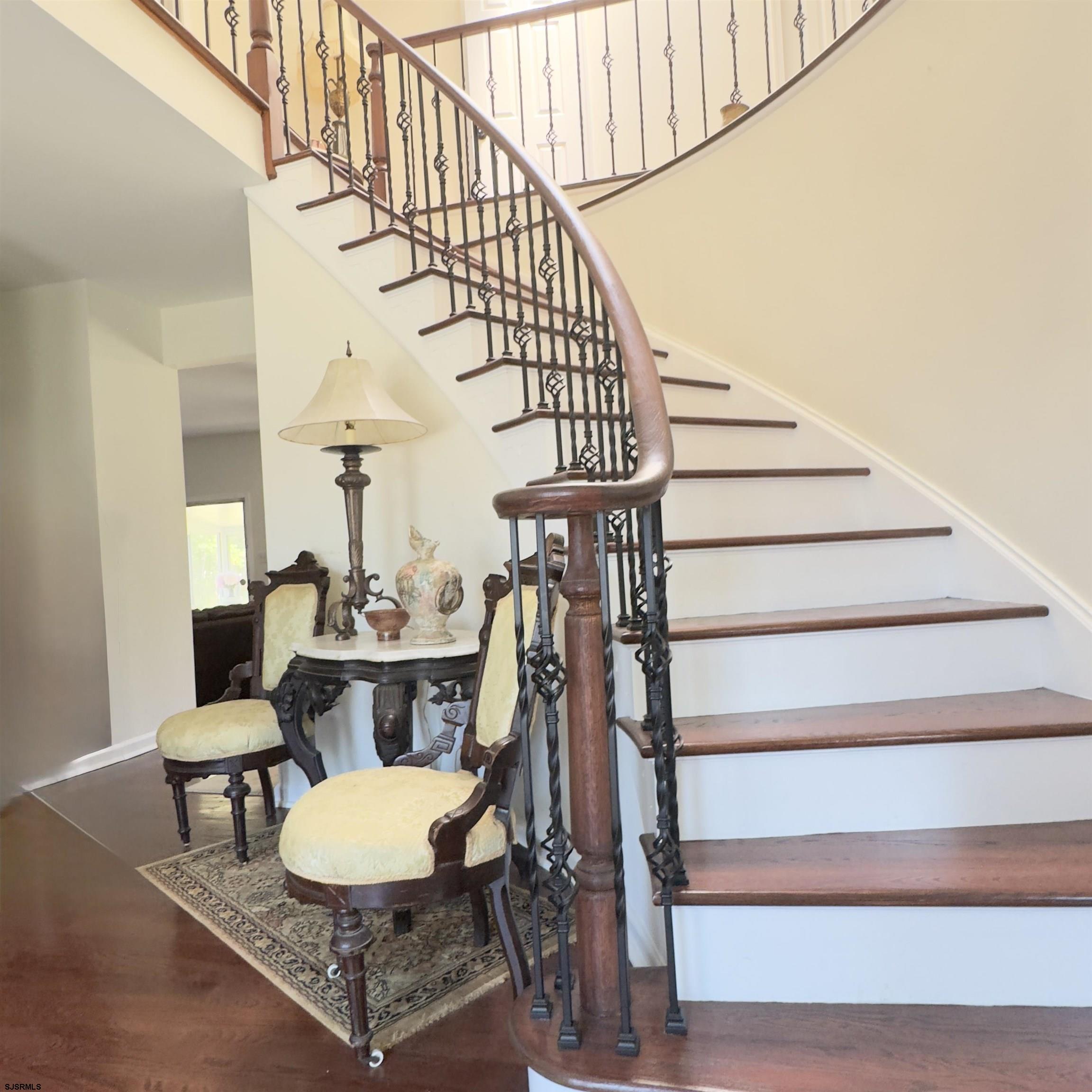 ELEGANT EXECiUTIVE HOME IN DESIRABLE HAMILTON WALK.  Discover refined living in this spacious executive residence nestled on over an acre in the sought-after Hamilton Walk community.  This impressive 4-bedroom, 2.5  baths home welcomes you with a grand two-story foyer featuring a sweeping curved staircase and skylight that creates an bright and open ambiance. The sun-drenched Florida room invites year-round relaxation, while the freshly renovated floors add modern warmth and style throughout.  The home boasts a new roof (2024) and a newly installed whole-house water treatment system.  This lovely home includes a spacious 2-car garage, an expansive concrete driveway, and an unfinished basement offering endless possibilities for future customization.  Situated in a prime location, you'll enjoy easy access to shopping, top-rated schools, casinos, beaches and boardwalks of Ocean and Atlantic Cities.  Don't miss this opportunity to own a grand home with timeless appeal and contemporary upgrades-all in a convenient prestigious neighborhood.