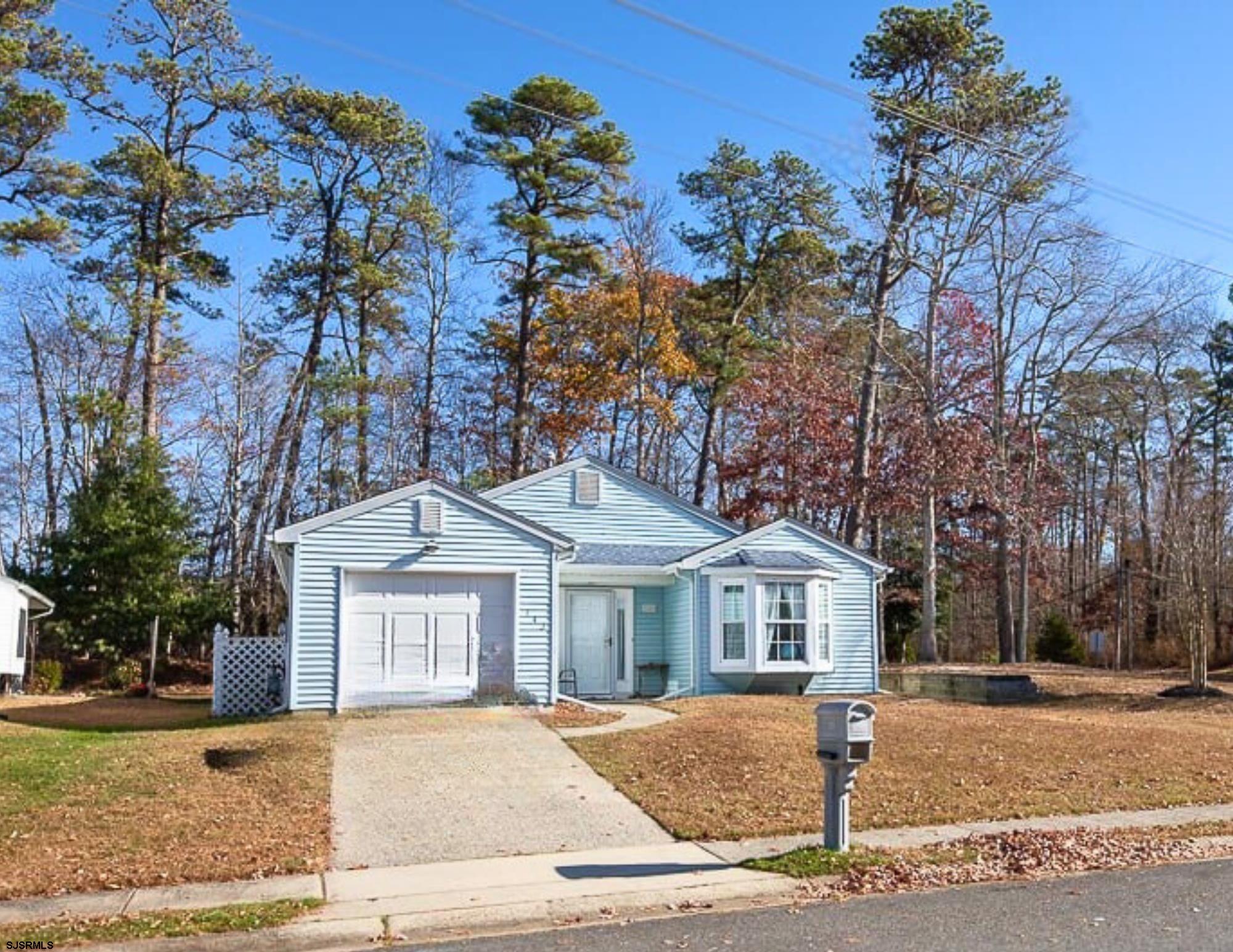 This charming two bedroom, two bath, ranch-style home, located on a desirable corner lot in the 55+ community of Mystic Shores.  Offering a bright and welcoming open floor plan, the spacious living and dining areas are perfect for relaxing or entertaining, while the eat-in kitchen provides plenty of additional space. Natural light pours in throughout the home, creating a warm and inviting atmosphere. The home features a convenient laundry/utility room and a one-car attached garage with direct interior access. An additional parking spot in the driveway ensures additional space for guests or an extra vehicle. Enjoy easy access to the Mystic Shores Community Center, located just a block away. As part of the community, you’ll have access to community amenities, including a fitness room, outdoor game courts, an outdoor pool, and a scenic walking/biking path. With a low monthly HOA fee of just $100, this home offers the perfect balance of comfort and convenience. Don’t miss out on this incredible opportunity to live in a vibrant and well-maintained community!