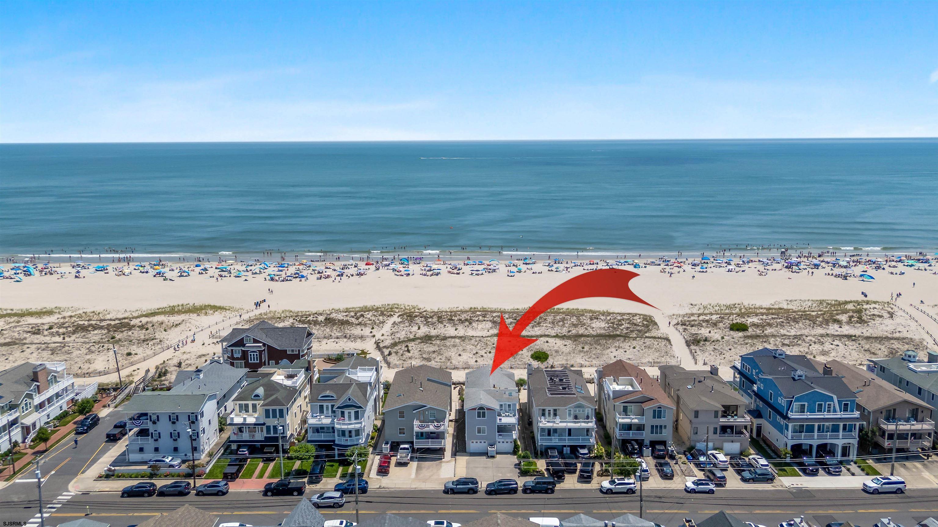 Located directly on the beachfront in Ocean City’s Southend, 4919 Central Avenue presents a rare opportunity: ownership of the ground along the sand, with city-approved plans and architectural flexibility already in place.  Set on a 37x100 lot, the existing duplex features 4 bedrooms and 2 full baths per unit, elevated above an oversized garage that provides generous off-street parking for both residences. Included with the sale are approved plans for a luxury single-family residence offering over 4,000 sq ft of living space across 2½ stories.  The proposed design includes 5 bedrooms, 5.5 baths, an elevator, expansive decks with sweeping ocean views, and thoughtfully designed bonus spaces such as a sitting area and private study — flexible enough to accommodate up to 7 total bedrooms. The top-level primary suite is generously sized and positioned to capture breathtaking views from its private deck.  Whether preserved as an upgraded duplex or transformed into a new custom home, 4919 Central offers buyers a unique position: direct beachfront access, grandfathered oversized lot coverage, and completed approvals that save time and create options. Opportunities like this are increasingly rare — and represent long-term value in one of the most desirable coastal markets on the East Coast.