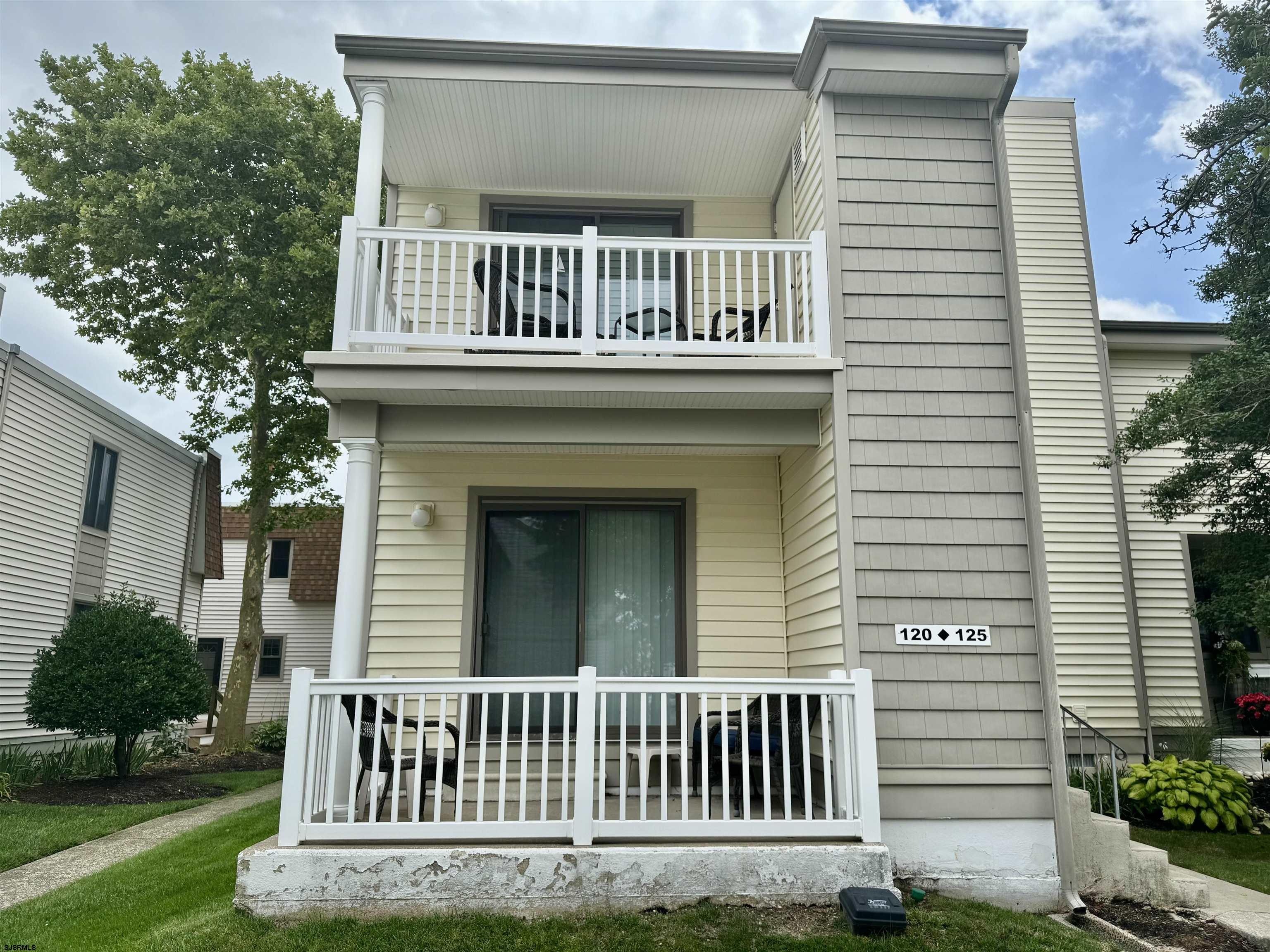 Welcome to 120 S Inlet Drive, a beautifully maintained 2nd-floor condo located in the desirable Ocean Village South complex in Ocean City’s peaceful South End. This 2-bedroom, 1.5-bath home has never been rented and shows true pride of ownership. Step inside to find soaring cathedral ceilings and an abundance of natural light that fills the open-concept living and dining area. Updates include plank flooring, newer air conditioning, water heater and more. Right off the living area is the galley kitchen which offers ample cabinetry, and a pantry closet. The thoughtfully designed Jack-and-Jill bathroom provides private access from the primary suite and convenient access from the hallway for guests. Both bedrooms feature generous sized walk-in closets. Enjoy your morning coffee or afternoon breeze on the private balcony. Not only is there an outdoor storage closet off the balcony but there's also a separate oversized exterior storage box ideal for bikes and beach gear. Additional features include plantation shutters on all windows, a full-sized washer and dryer, two hallway closets, one assigned parking space, and access to a community pool and clubhouse. The condo is being sold fully furnished! Whether you're looking for a move-in-ready home, a low-maintenance vacation home, or a promising investment opportunity, this 2nd floor unit at 120 S Inlet Drive checks all the boxes.