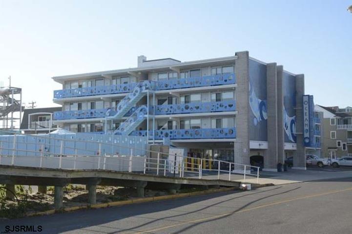 Located at the foot of 7th Street boardwalk, Ocean 7 has one of the best locations in town. Building is professionally managed with front desk and maid service. The building features off street parking, heated pool and elevator. The building is family friendly, smoke free, no pets allowed. This studio apartment sleeps four and has a fully stocked kitchenette. Located on the pool side of the building you have a clear view of the boardwalk ramp and a peak of the ocean. Strong rental history. Seller is a licensed NJ Realtor.