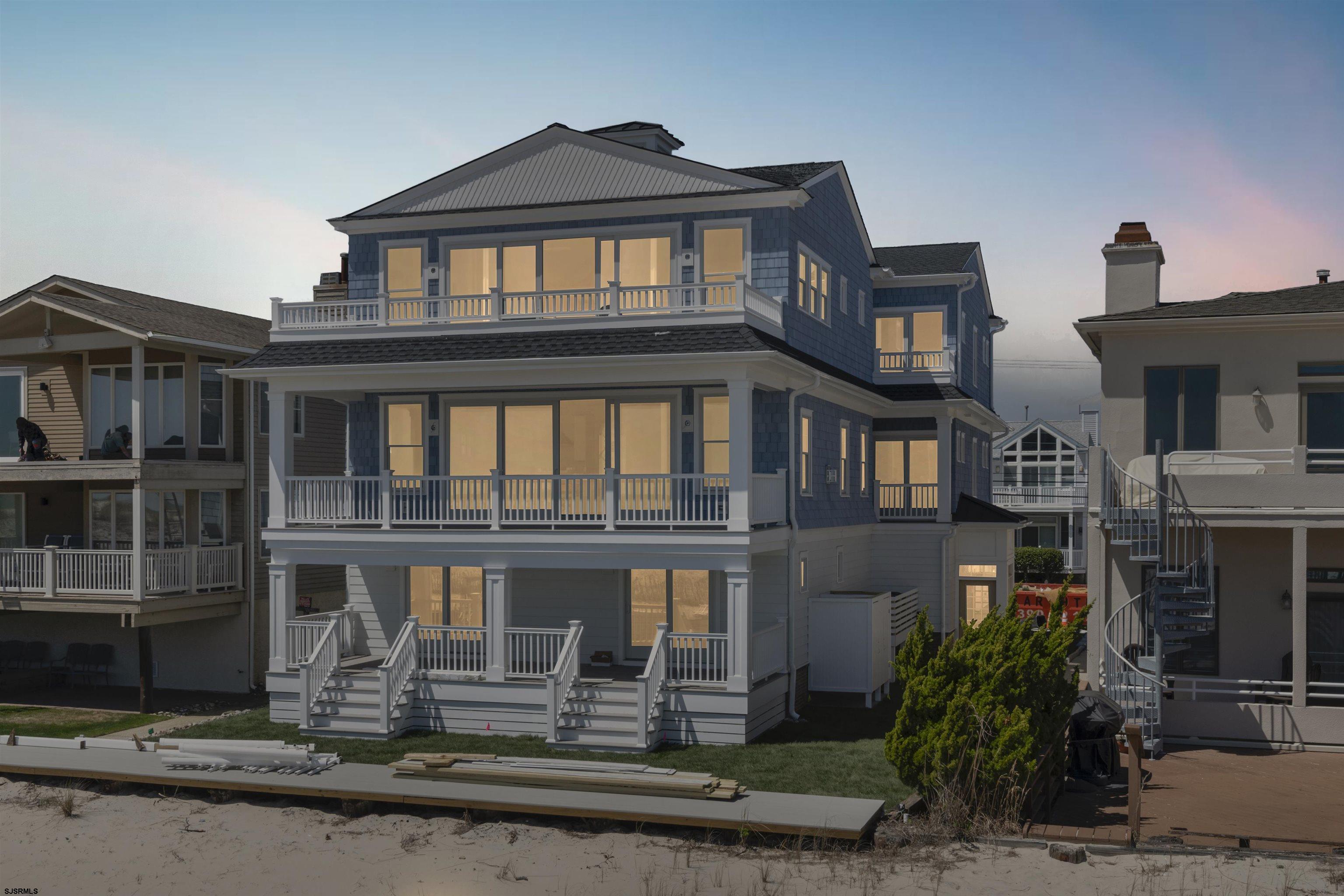 Rare opportunity to own this designer furnished beachfront condo, built in 2023 this lower unit sits on a 50 x 100 foot lot in the desirable South End. Boasting second floor beach and ocean views and over 3,150 square feet of luxury living space including 5 bedrooms, 4.5 bathrooms, 4 decks, gourmet kitchen with wine fridge, great room with fireplace, private elevator, driveway and over-sized garage with electric vehicle charger. Ground floor of this unit has an impressive entry foyer, full bath and private cabana with full size video games and queen sleeper sofa. The property includes a beautifully manicured beach-front lawn and outdoor shower. Being sold fully furnished in addition to offering every amenity necessary to make this investment property a hit with vacationers both on and off season. Comfortably accommodates up to 16 guests. Excellent income potential with the Summer season 2025 booked already. Sweeping panoramic views of the beach and ocean spanning from Atlantic City to Strathmere. Ideally located to enjoy the beauty and tranquility of the South End within proximity to the Ocean City boardwalk/downtown area and Sea Isle City restaurants and nightlife. Enjoy the Summer in Ocean City with your family and/or rent it out for additional income.  If you have been considering buying beach front property in Ocean City this is a must see!