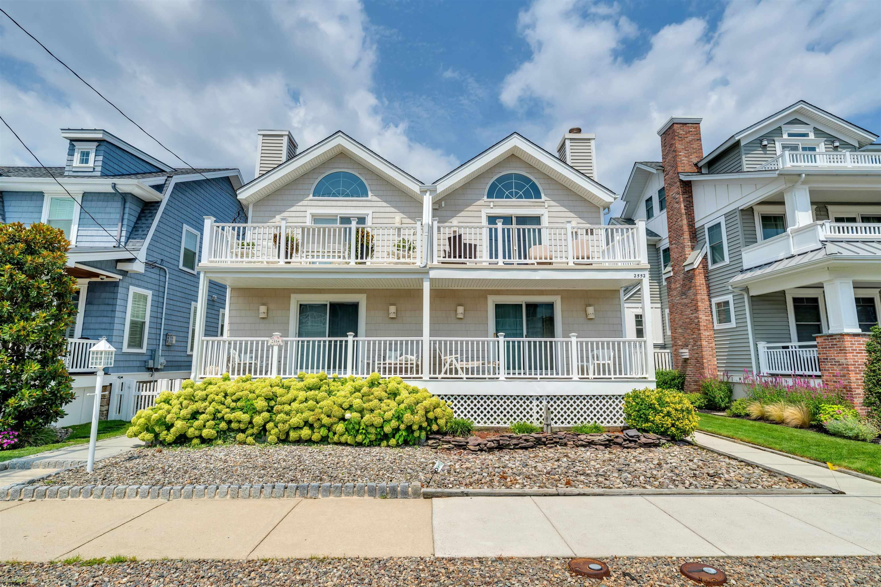 For a limited time, seller is offering up to $40,000 at closing towards a permanent buy down on a 30-year fixed-rate mortgage to a qualified buyer. Approximate rate could be as low as 4.95%. Buy down incentive offered exclusively though specific lender and buyer must put down at least 20 percent. Subject to buyer qualifications and lenders approval. Rates, terms and availability subject to change without notice. Please contact listing agent for details.  Welcome to 2552 Asbury Avenue, a spacious and well-maintained 4-bedroom, 2.5-bath townhouse ideally situated in Ocean City's prime mid-island neighborhood. Just a few short blocks from the beach and boardwalk, this home offers the perfect combination of location, layout, and investment potential.  The second floor features a bright and open living space with vaulted ceilings, a statement arched window, and sliding doors that lead to the front deck, perfect for enjoying the fresh ocean air and sunshine. The open-concept design includes a spacious living area with a fireplace, dining space, and a kitchen with ample storage and an extra large peninsula island. Also on this level is a half bathroom and a bedroom, ideal for guests or use as a home office.  Downstairs, the first floor offers three bedrooms, including a spacious primary suite with a private full bath and direct access to a covered front porch. Two additional bedrooms, a full hall bath, and a laundry closet complete the level.  The exterior offers multiple outdoor living spaces, off-street parking, an outdoor shower, and a storage closet—features that are highly desirable for both personal use and summer rentals.   This home presents an excellent opportunity for buyers seeking to customize and add value. Its strong rental potential, ideal location near beaches and amenities, and flexible floor plan make it a standout choice for second-home buyers and investors alike.  Don’t miss your chance to own a property that checks all the boxes for location, space, and long-term value in Ocean City. 2552 Asbury Avenue is ready to be enjoyed now and enhanced for the future.