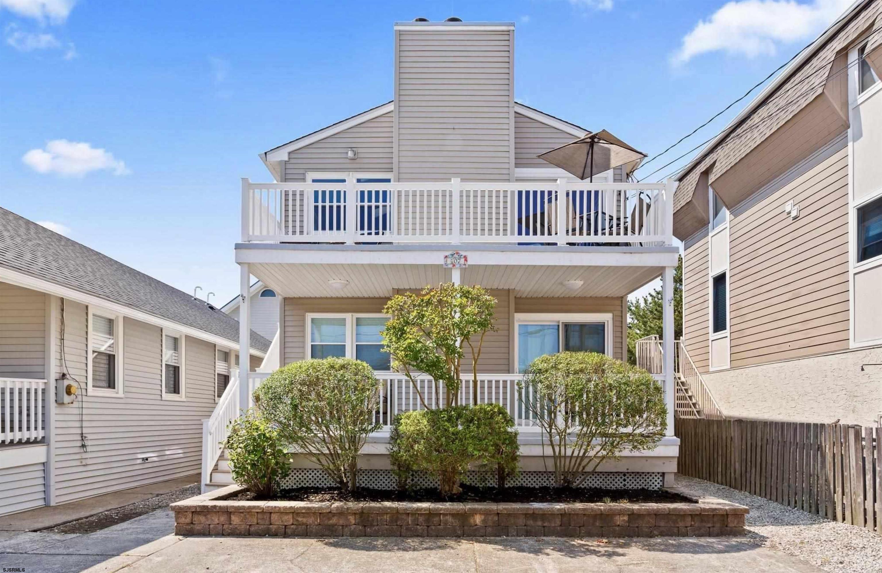 Welcome to the East Side of the Gardens, where modern elegance meets beachside charm! Discover this stunningly redesigned 3-bedroom, 2-bathroom second-floor condominium, offering an inviting sanctuary perfect for the contemporary lifestyle. Step inside and be captivated by the vaulted ceilings adorned with striking batten-laid woodworking, providing a beautiful centerpiece in the main living area. The heart of this home is a brand-new culinary masterpiece: a kitchen boasting sleek upgraded cabinetry, a chic center island, quartz countertops, ceramic tile backsplash, and stainless-steel appliances. Every detail has been carefully chosen, from the resilient pre-engineered hardwood flooring to the new doors and trim that seamlessly complement the modern aesthetic. Drift into relaxation in the custom-tiled bathrooms, elegantly illuminated by stylish new light fixtures. Fresh coats of paint enhance the airy ambiance throughout. Outside, unwind on your spacious front porch or enjoy a quiet moment on the rear patio. Practical perks await with extra storage, off-street parking, and even an outdoor shower to rinse away the sand after a day at the beach. Best of all, this exquisite retreat is just a single block away from the shimmering shoreline, your ticket to endless seaside adventures and golden sunsets. The property has an impressive rental history, making it an excellent investment or wonderful second home!