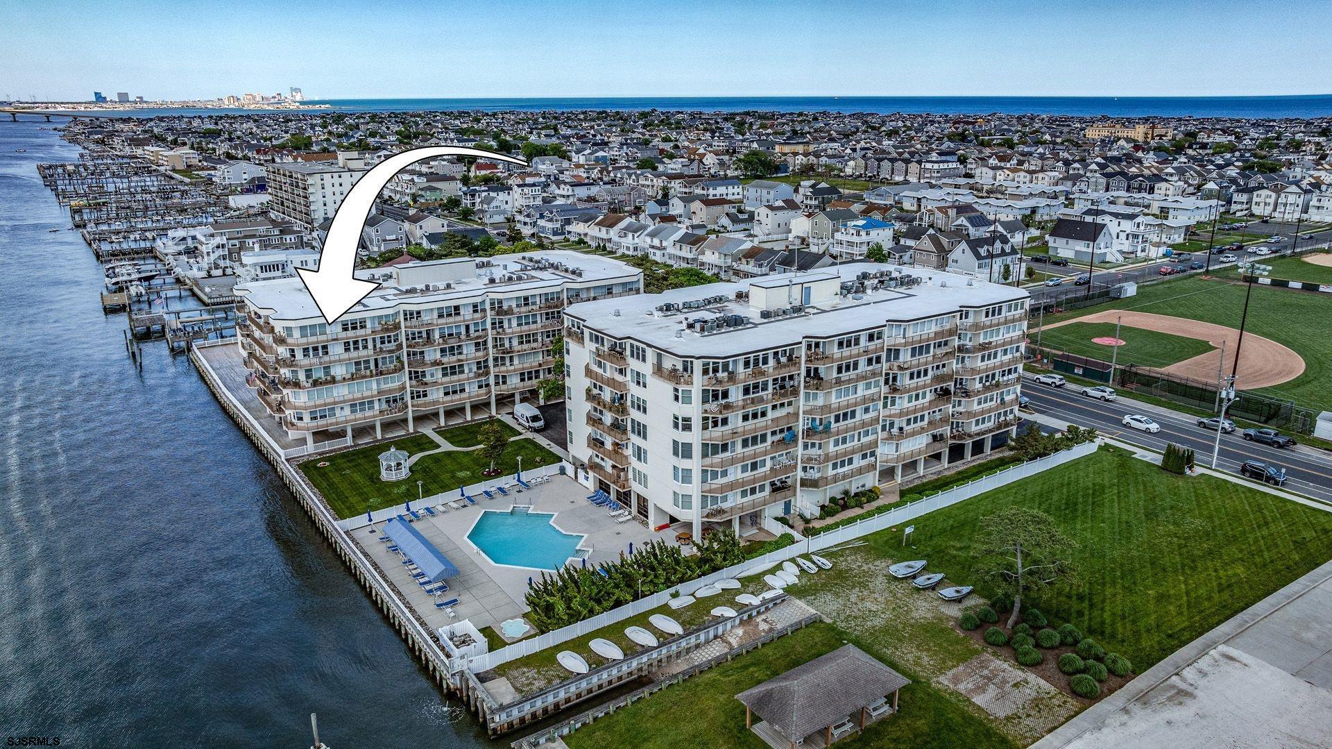 Spectacular move-in ready BAY FRONT UNIT! Completely updated 2-bedroom, 2-bath offers breathtaking BAY views and an expansive balcony—perfect for enjoying your morning coffee, evening sunsets, and everything in between. Phenomenal designer chef's kitchen. Custom built-in wet bar with beverage fridge. Fantastic OPEN CONCEPT kitchen/wet bar/dining area & living room with balcony access - very SPACIOUS for entertaining & perfect for relaxation. Truly one of a kind. INCREDIBLE master suite with direct endless BAY views. Large walk-in closet & gorgeous bathroom. Enjoy the many amenities 500 Bay has to offer including gym, on-site management, garage parking, bay front POOL, bay front boardwalk & sitting area. Walking distance to great shops & restaurants! The best of Ocean City living is right here! Call today for more information.  Condo Unit: https://youtu.be/-fZn24RHdcM  Amenities: https://youtu.be/PvzyMQILdpM