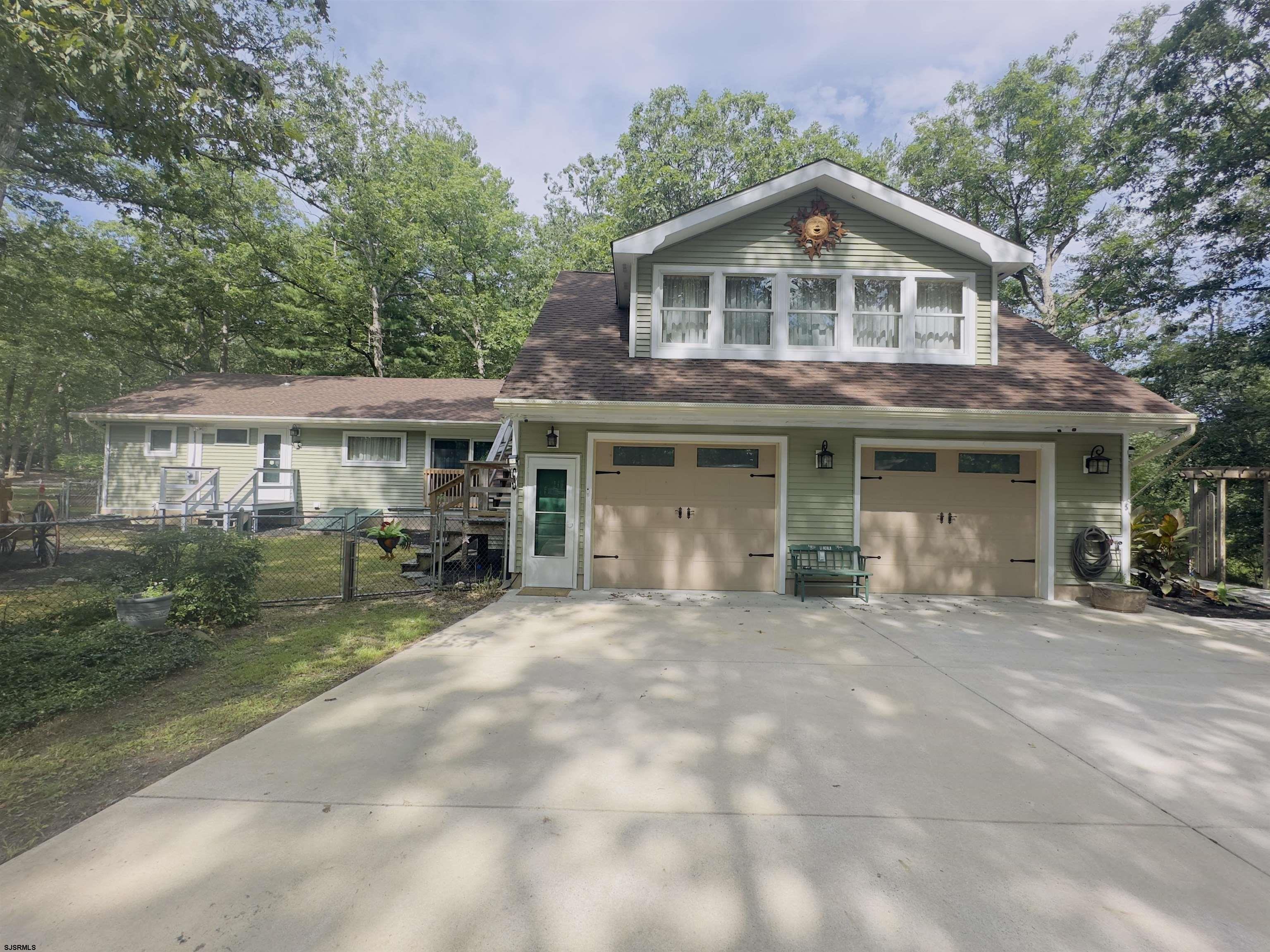 ***MAYS LANDING RIVER FRONT NEW LISTING ALERT***3 BED 2 FULL BATH***CUSTOM WOODSY COTTAGE FEEL***ANDERSEN WINDOWS/SLIDERS***BOSCH GEO-THERMAL HEATING/COOLING(2018)***3 SHEDS W/ ELECTRIC***GAS HEATED OVERSIZED 3 CAR GARAGE***200AMP ELECTRIC(2008)***GUTTER GUARDS***HEATED/COOLED PAVILION OVERLOOKING THE RIVER***NAVIEN TANKLESS GAS W/H(2018)***NO FLOOD INSURANCE REQUIRED***WALK-UP ATTIC STORAGE W/ SPRAY FOAM INSULATION***CUSTOM HANDMADE LIGHT FIXTURES***WOOD VAULTED CEILINGS***EN SUITE W/ BONUS OFFICE OVERLOOKING RIVER***POT FILLER***CUSTOM MADE KITCHEN CABINETRY***1.3 ACRES***1,754 SQ FT***TURN-KEY***  Heavenly High Bank Road~Gorgeous home nestled into the woods that has incredibly brought the "woods" into this custom, one of a kind home! Shrouded in custom wood work throughout, this home offers coziness, comfort along with tranquility. Impeccably maintained inside and out, this home oozes with pride in ownership. Curb appeal is fantastic, pulling up, this large frontage lot offers a plethora of parking as well as garage storage. Family room/kitchen & dining area are all open to one another, drenched a natural light from the windows and multiple sliding doors. Wooded vaulted ceilings, tree trunk beams make this space spectacularly stunning. Two bedrooms on this floor offer convenience. Full bath offers beautiful vanity, tiled shower along with laundry. Entire 2nd floor is en suite featuring office area with 180 degree window overlooking the river. Bathroom is oversized with huge shower encrusted with river rock and slate-like tile. Built-ins for storage make for a great wall in this space. Built in-desk area offers 2nd work space. Pavilion at rear of the property overlooks the water, offers gas fireplace, heat/air, eisenglass windows zipper open/closed & offer screens for air-flow. TV in this space make for a great bonus den/gym/craft room, reading room and so many more possibilities. Garage offers incredible space for cars as well as storage that is heated by gas for comfort. For full video tour, go to realtor dot com and type in address 2015 High Bank Rd Mays Landing NJ 08330.