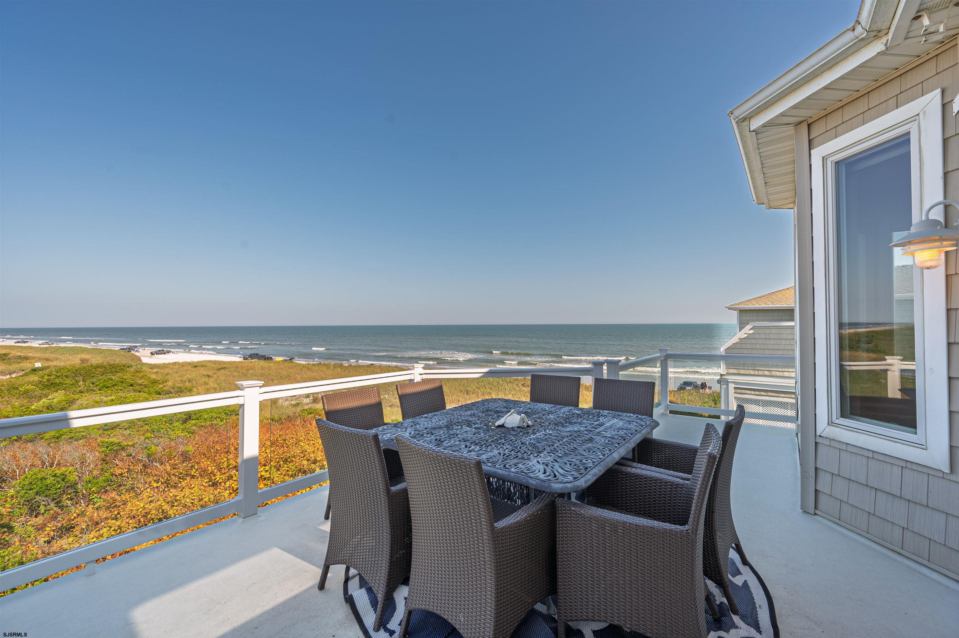 Unrivaled Oceanfront Living at the North End of Brigantine ! Discover timeless coastal elegance with this exceptional 6 bedroom, 5-bathroom oceanfront estate, ideally positioned on a private street at the coveted north end of Brigantine Island. Showcasing a thoughtfully designed reverse floor plan, the home's upper level unveils sweeping, unobstructed views of the Atlantic Ocean-arguably the most spectacular oceanfront vantage point on the entire island. From sunrise to sunset, this residence offers unparalleled beachfront lifestyle with expansive living area, walls of windows, and seamless indoor-outdoor flow. Whether hosting summer soirées or enjoying quiet moments by the sea, every detail reflects sophistication and comfort. Remarkably priced under $3 million, this is the only direct oceanfront at this price on Brigantine, making it a rare and exceptional offering. For those seeking privacy, luxury, and the magic of oceanfront living, this is the opportunity you've been waiting for !