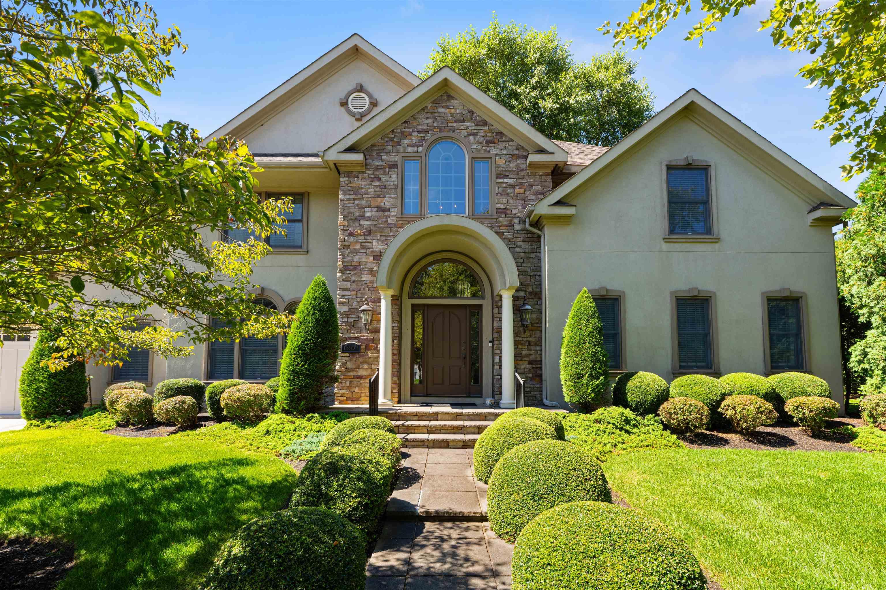 Welcome to this exquisite and expansive 5 bedroom 4 full and 2 half bath home. This stunning residence is perfectly designed for entertaining, hosting and comfortable daily living. Situated on a desirable corner Gold Coast lot, you are just steps to Linwood's updated All Wars Memorial Field, public playground, bike path and schools. Inside you'll find an open and flowing floor plan highlighted by high ceilings, abundant natural light, main level surround sound and elegant finishes throughout. The chef's kitchen is a true centerpiece, complete with premium appliances, leathered quartz counter tops and plenty of storage. There are multiple living areas throughout. Off the kitchen is a sunken family room encased with French doors for ease when wanting to transition outside. The primary suite on the main level provides a serene retreat with a spa like en-suite bathroom including radiant heated italian marble floors, cast iron soaking tub and commercial grade steam shower. All additional bedrooms have ensuite bathrooms. Upstairs opens to a spacious sitting area, creating a warm and welcoming hub that connects the adjacent bedrooms. A dedicated theater room enhances the homes entertainment value, offering a perfect place for movie nights or sporting events. For added convenience, there is a laundry room on both the main level and second level of the home. Additionally, to offer maximum efficiency, a dual zone Geothermal heating and cooling system. The third floor provides even more flexibility serving as a 5th bedroom, gym (already equipped with gym grade rubber flooring), office or recreation space complete with its own full bathroom.  Step outside on the enormous second floor back deck or enjoy beautifully landscaped grounds on main level. Enjoy this turnkey home today.