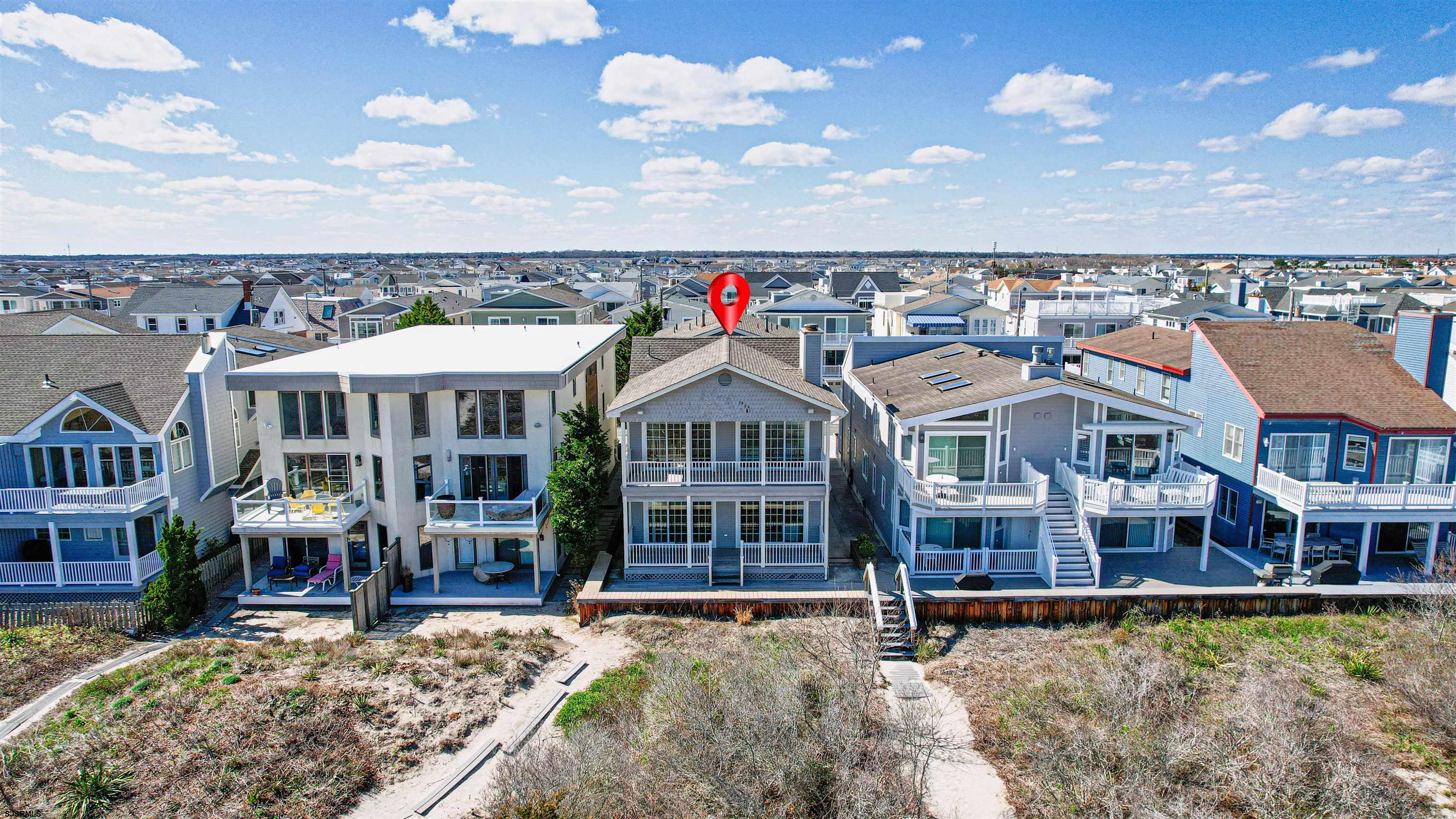 Welcome to 2924-26 Wesley Ave! Located in Ocean City's exclusive Gold-coast neighborhood, this immaculate duplex offers an open floor plan, granite, quartz, and tile throughout. This home has been meticulously maintained and has amazing ocean views! Also featuring private garages and plenty of storage. Enjoy your private path to the beach directly from your home. Why buy one floor of a duplex when you can buy the entire building along with Gold-coast beachfront ground!!