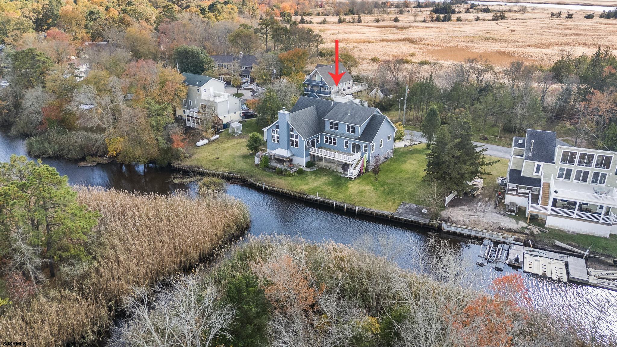 WATERFRONT! Do You Need Space for Parents and Children and Desire To Live On The Water? This Custom-Built 4Bedroom 3 1/2 Bath Home Has A True Multi-Generational Layout, including Two Suites on the Main Living Level! Other Outstanding Features Include Bulkheaded Waterfront, Elevation is Approximately 15 Feet, Flood Insurance is Approximately $970 Per Year, A Full Basement For Storage, Attached 2-Car Garage +Detached Garage/Workshop, An Outdoor Kitchen + Brick Hearth Pizza Oven And So Much More!  Live Like You Are On A Vacation Every Day In This Beautiful Waterfront Custom Built One Of A Kind Home! Located on a Desirable Intimate Waterfront Lane in Egg Harbor Township This Property Is Truly A Dream Come True! Be One With Nature In Beauty From Your Own Back Yard-Travel By Boat Along The Great Egg Harbor "Wild And Scenic" River, Which Leads To The Great Egg Harbor Bay And Ocean For Your Relaxation, Fun, and Enjoyment! 3483 Square Feet Of Open Spacious Living. Including Two Separate Primary and Junior Bedroom Suites On The First Level Living Space Of The Home Suitable For Multigenerational Family! Entry Foyer, Formal Dining Room, Living Room Fireplace, Great Room/Family Room, and An Awesome Kitchen All with Priceless Views! Upstairs Are Two Large Second Floor Bedrooms with An Additional Game Room/Playroom/Study Room/Family Room Area! Basement Level Has So Much Storage And Is Very Spacious! Two Car Attached Garage, Plus Detached Garage And Workshop, Outside Kitchen and Brick Hearth Pizza Oven You Gotta See and So Much That You Will LOVE and ENJOY! THIS EXTRA SPECIAL PROPERTY IS VALUE PRICED AT $994,999! Make This Home Your Own Home!