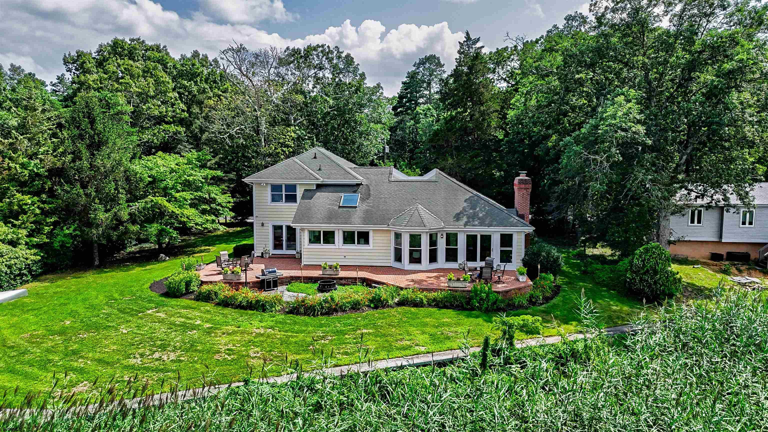 Experience luxurious riverfront living in this fully renovated custom home! Originally built in 1994 and completely updated in 2025, this 3-bedroom, 2-bath masterpiece combines timeless craftsmanship with modern elegance. The spacious open floor plan features vaulted ceilings, an interior atrium with marble flooring, and abundant natural light throughout.  The chef-ready kitchen is a showstopper—complete with a six-burner gas stove, stainless steel appliances, quartz countertops, a large pantry, endless storage and a stunning skylight. Located on second floor expansive primary suite includes a walk-in closet and a spa-like modern bath.   Enjoy year-round water views from nearly every room, or step outside to your brick patio that spans the entire back of the home. With a private dock, floating dock, and jet ski lift, this property is ideal for boating and waterfront relaxation. Additional highlights include a two-zone geothermal heating system and exceptional attention to detail throughout.  Don't wait! Call for appointment today!