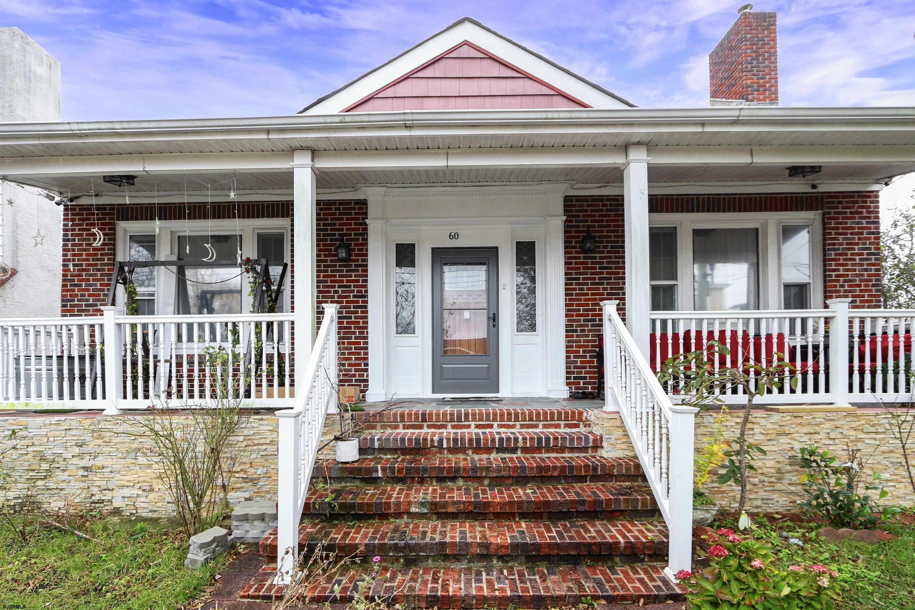 The perfect getaway!  Corner lot brick home just 2 Blocks from the beach!!! Hurry this one won't last! Perfect for a summer home, Air B & B or year round. Offers 5 bedrooms plus a finished basement. Beautiful modern kitchen w/ granite. Master suite with it's own master bathroom. fenced in backyard, garage and more. Kitchen and bathrooms all upgraded. Easy to show by appointment only.