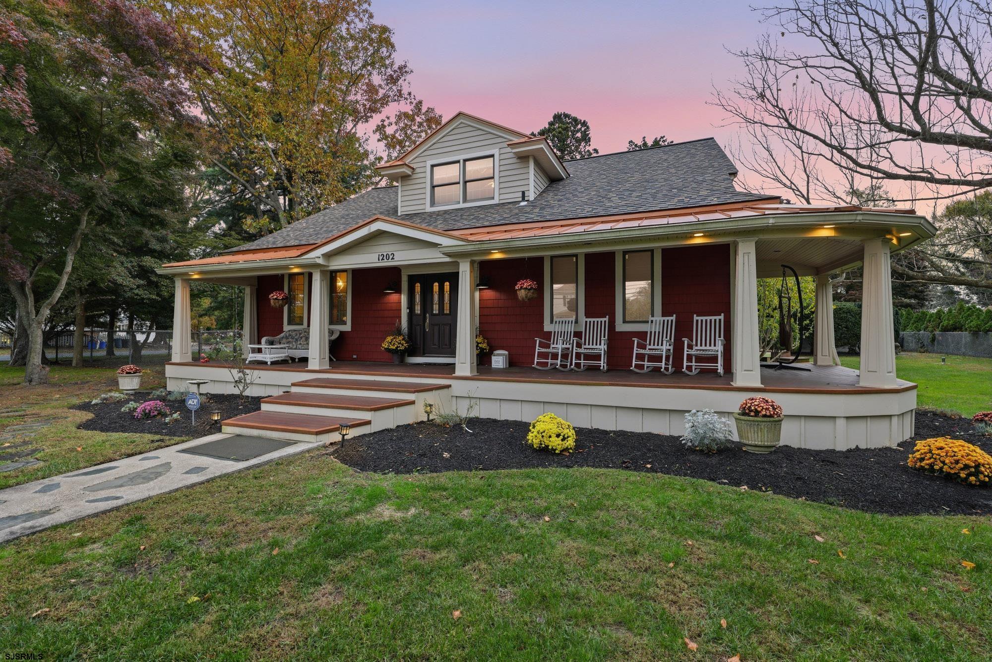 Nestled in the quaint town of Northfield, this beautifully preserved 1903 home blends timeless character with elevated modern living. Set on an oversized, private lot along the prestigious Atlantic City Country Club, it offers peaceful sunrise views, privacy, and an inviting upscale atmosphere.  Inside, ornate ceilings, graceful arches, and historic detailing pair seamlessly with high-end granite countertops, an elegant backsplash, and GE Café appliances. The open floor plan makes entertaining effortless and creates a warm flow for enjoying time with loved ones. Light beams in from every angle, with window upon window illuminating the piano room, kitchen, morning room, and the dining room—complete with crown molding and a custom window seat. The family room showcases large picture windows framing the beauty of the outdoors, while a small den offers the perfect office or craft space. Closets are abundant throughout the main level.  The main floor also features a beautifully finished full bathroom with classic subway tile. The primary bedroom includes original hardwood floors with a cherry inlay, double closets, overhead storage, and a refined primary bathroom with two large vanities and a fully tiled stand-up shower.  Upstairs, four additional bedrooms and a full bathroom provide flexible living options for family, guests, or quiet retreats.  Outdoor living enhances the home’s charm. A newly renovated wraparound front porch sets a welcoming first impression, while two rear decks offer ideal spaces for relaxing or entertaining. A tranquil pond—home to goldfish and a longtime snapping turtle—sits among seasonal flowers that brighten the property year-round. Birds frequent the yard, butterflies glide through the gardens, rabbits hop along the lawn, and each season brings a fresh display of flowers and color. A two-car detached garage and single shed add storage and convenience.  Blending historic elegance, thoughtful upgrades, remarkable privacy, and a premier golf-course setting, this Northfield home offers a truly exceptional living experience.