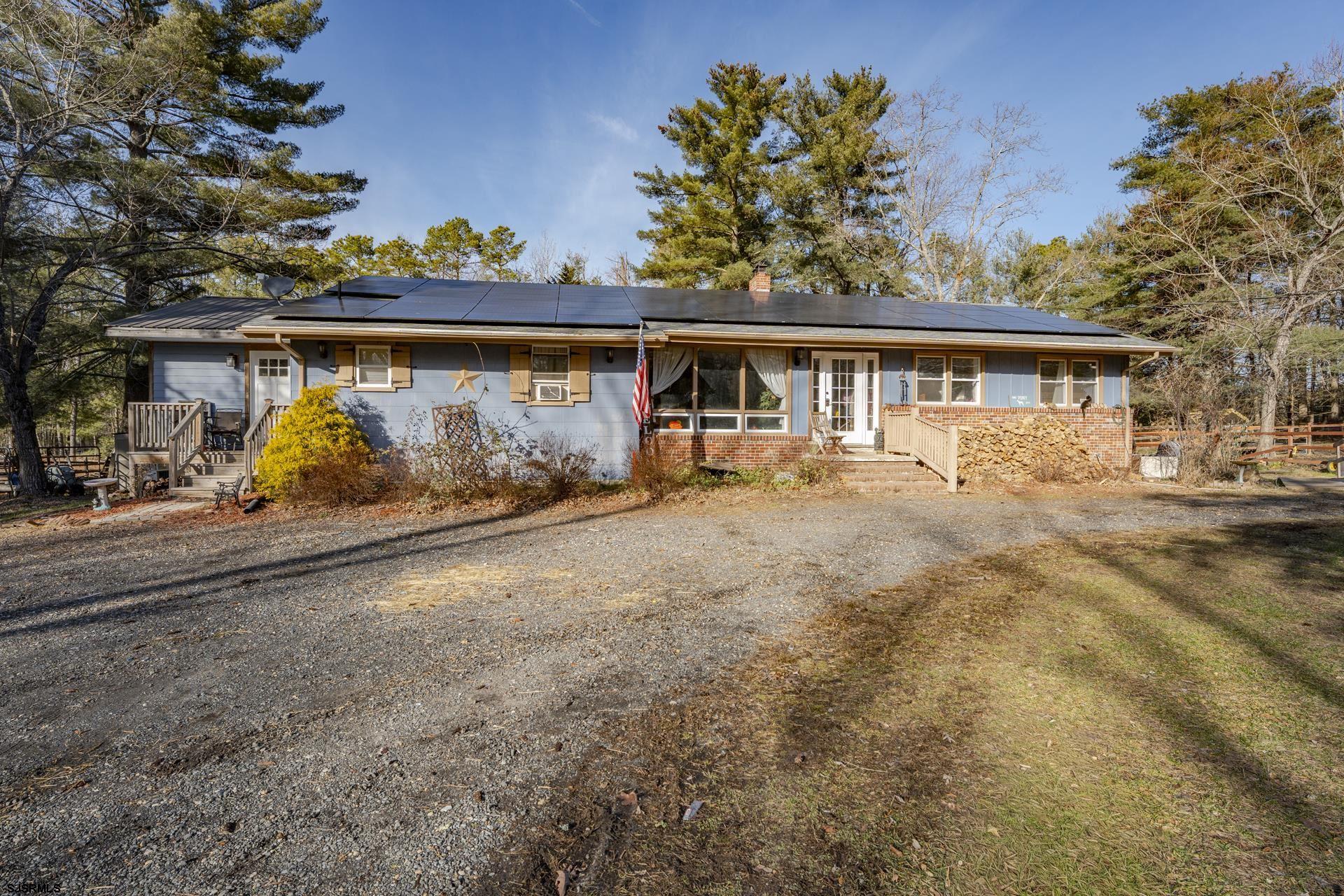 Welcome to 1853 McCall Ave — an expansive 4.37-acre rancher offering land, privacy, and exceptional versatility. With 5 total bedrooms and 3 full bathrooms, this property works beautifully as a spacious single-family home, a rental income opportunity, or a layout that supports multigenerational living. The main residence includes 3 bedrooms, 1 full bath, a generously sized kitchen, and a bright, open living room ideal for gatherings. Attached to the main home is a completely separate in-law suite, featuring 2 additional bedrooms, 2 full bathrooms, a private entrance, its own electric meter, a full kitchen, dedicated washer and dryer, and a charming four-season sunroom perfect for added living or relaxation areas. A partially finished, full basement adds even more potential for storage, hobbies, or further expansion. Outdoors, the property truly shines with the kind of acreage that’s rarely available. You’ll find abundant space for recreation, gardening, animals, or enhancements you may envision. Equestrian and hobby-farm enthusiasts will appreciate the horse corral, four paddocks, and extensive fencing, while everyone will enjoy the fire pit area, hot tub, and peaceful natural surroundings. A long private driveway and ample parking complete the package, creating a flexible retreat with room to grow — and the option to generate income. Experience comfortable country living with unmatched flexibility. Schedule your tour today!