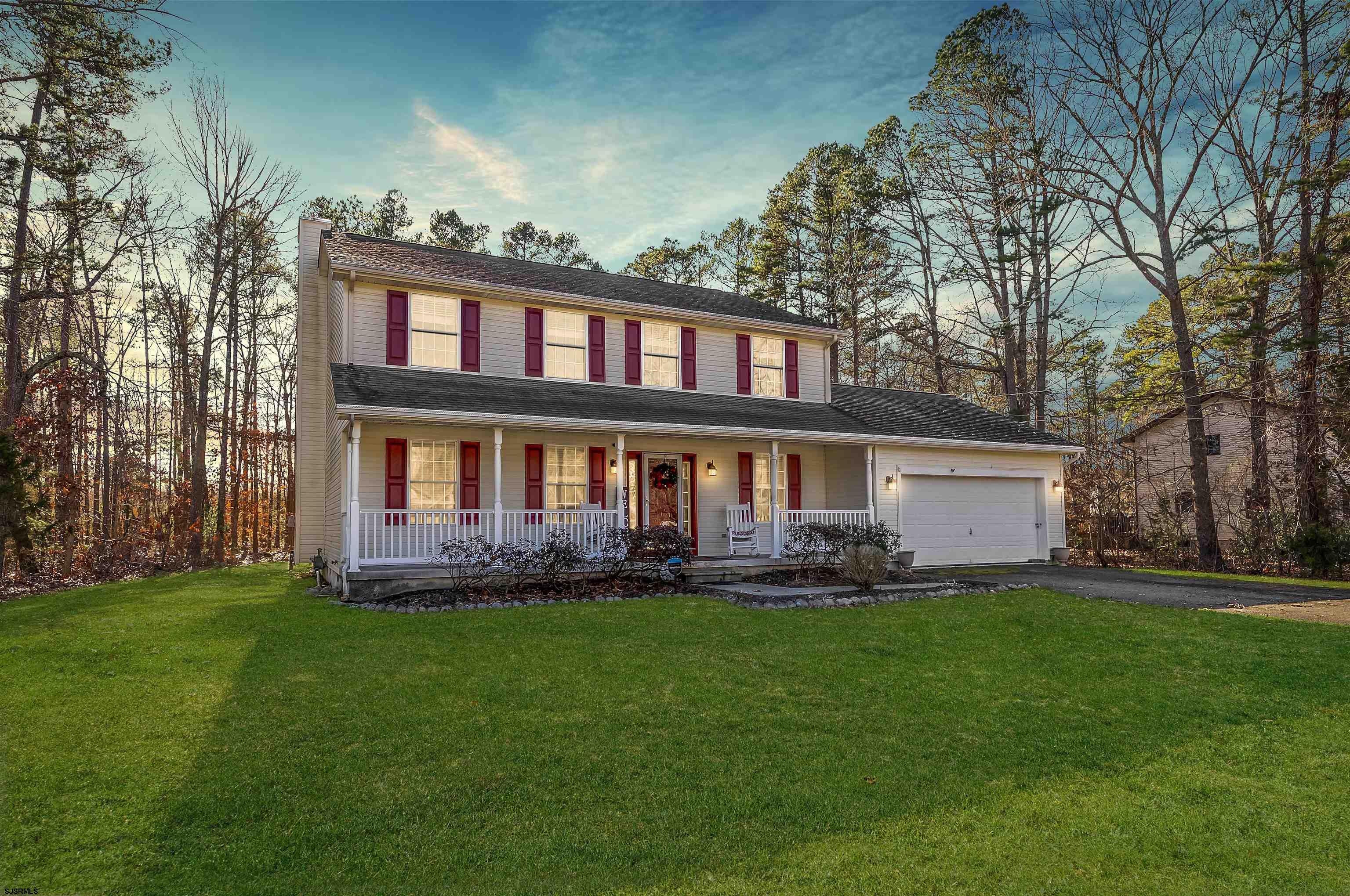 Welcome to 570 North Street, where space, serenity, and outdoor living come together. Set on just over an acre of land showcasing beautiful wooded scenery, this custom-built home offers a private, picturesque setting backed by preserved farmland. This property delivers a rare sense of calm and seclusion that’s truly a gem to find in South Jersey;  you can enjoy nature as your everyday backdrop.  Built in 2002 by the current owners and meticulously maintained, the home was thoughtfully designed with both comfort and functionality in mind. Turn-key and ready to go;  just pack your bags and move right in.  A charming front porch welcomes you home and sets the tone for what’s inside. The first floor features an inviting, well-connected layout including a formal living room, a second cozy living room with a fireplace, a formal dining room, powder room, and an eat-in kitchen ideal for everyday living and effortless entertaining. Just beyond, a slider leads to the the sun-filled three-season room, offering tranquil views of the expansive yard and surrounding woods; a space that truly feels like vacation every day. Off the laundry area, a flexible bonus room provides endless possibilities as a guest room, home office, playroom, or home gym, with a nearby shower and sink area that’s perfect for guests or multi-generational living.  Upstairs, the primary suite is complemented by three additional bedrooms and two full bathrooms, creating spacious accommodations for all. Storage is plentiful throughout the home, with large closets and a bonus of attic space designed to keep everything organized.   Outside, the property truly shines. The backyard offers exceptional potential to create the outdoor space you’ve always envisioned, whether you love gardening, dream of an outdoor chef’s kitchen, or envision a wide-open space for play and pups to roam. A custom deck sets the stage for entertaining, from summer BBQs to quiet morning cups of coffee.   Practical features include a half-garage, storage shed, irrigation system, invisible pet fence, gutter guards, and additional storage areas that provide ample room for tools, toys, and hobbies.  For the nature enthusiasts, this home is conveniently located with easy access to parks, rivers, and nature trails. Gorgeous shore points, iconic South Jersey beaches, dining and shopping are easily accessible. Trips to Philadelphia, Atlantic City, or Cape May are all right at your fingertips, this home truly showcases the best parts of living in South Jersey.  Schedule your private showing and experience this special property for yourself.