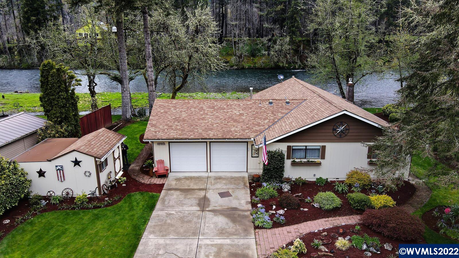 Accepted Offer with Contingencies. Some of the best Santiam River frontage on a slow & peaceful section of the river.  Open vaulted floor plan with floor to ceiling windows to enjoy the unobstructed views.  Kitchen has been nicely updated with new cabinets, island & granite counters.  Large deck, patio & firepit area.   The house has been exceptionally well maintained.  100' deep paved driveway allows room for parking all your guests.   Unique frontage has shallow side channel & seasonal island that allows much safer swimming.