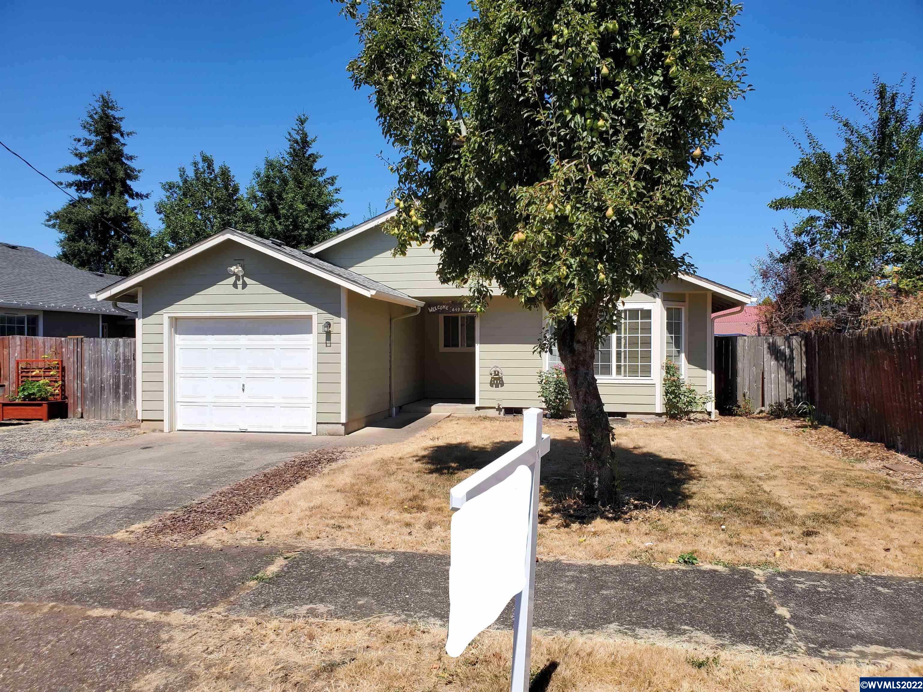 Beautiful updated new light green siding on this single level 3 bed / 2 bath home! Roof is less than 5 yr old. Large fenced yard for entertaining or gardening; juicy pear tree out front. Solid wood kitchen cabinets. Built in 1993, double paned windows. Storage garage has 200 AMP panel. Immediate occupancy available. Bike/walk to Century Park, medical, downtown shopping/dining, Western University, library and easy Hwy 34 commute to Corvallis.