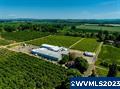 This 16.2ac berry farm has 8.25ac of planted organic Ananasnaya Kiwi Berries in Cloquato soils w/ 12.7ac of Water Rights, w/ a 1981 priority date. The property features a 21,525SF processing facility, a 9,200SF warehouse w/ dry storage, 4,032SF 10-controlled atmospheric rooms that hold 75,000lbs each & various other buildings! The property also has a 2,738SF home & a 1,955SF manufactured home that recently underwent improvements. Excellent infrastructure, quality soils, & a beautiful home!