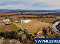 This 96.5 acre listing combines properties on McKibben Rd & Loganberry Lane! Grouping this farm gives you 58.2acres of Blueberries & 37.25acres of Kiwi Berries. The entirety of the property has Cloquato soils, & the majority is covered in water rights. This property features 3 homes & a 21,525 SF processing facility, a 9,200 SF warehouse w/ dry storage, 4,032 SF 10-controlled atmospheric rooms that can hold 75,000 lbs each designed for maximizing farm production all in one place!