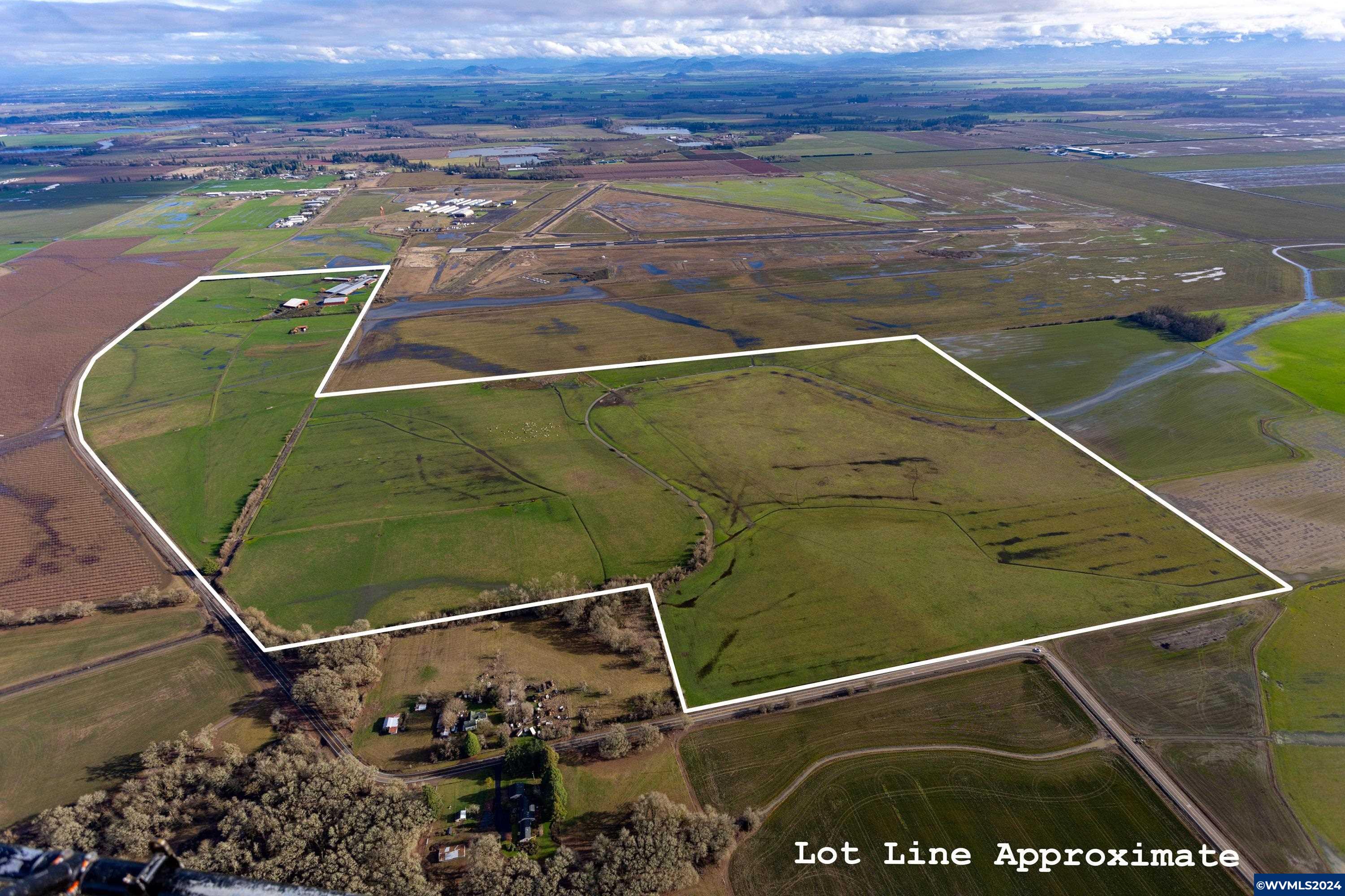 Accepted Offer with Contingencies. Discover this 279-acre organic dairy farm in South Corvallis! Spanning 3 parcels, it features 256 acres of prime tillable and pasture land with Woodburn, Concord, and Dayton soils, plus a 40-acre groundwater claim. Includes 2 homes on separate tax lots, plus ample outbuildings for hay, equipment, and milking. Adjacent to the airport, offering endless potential!