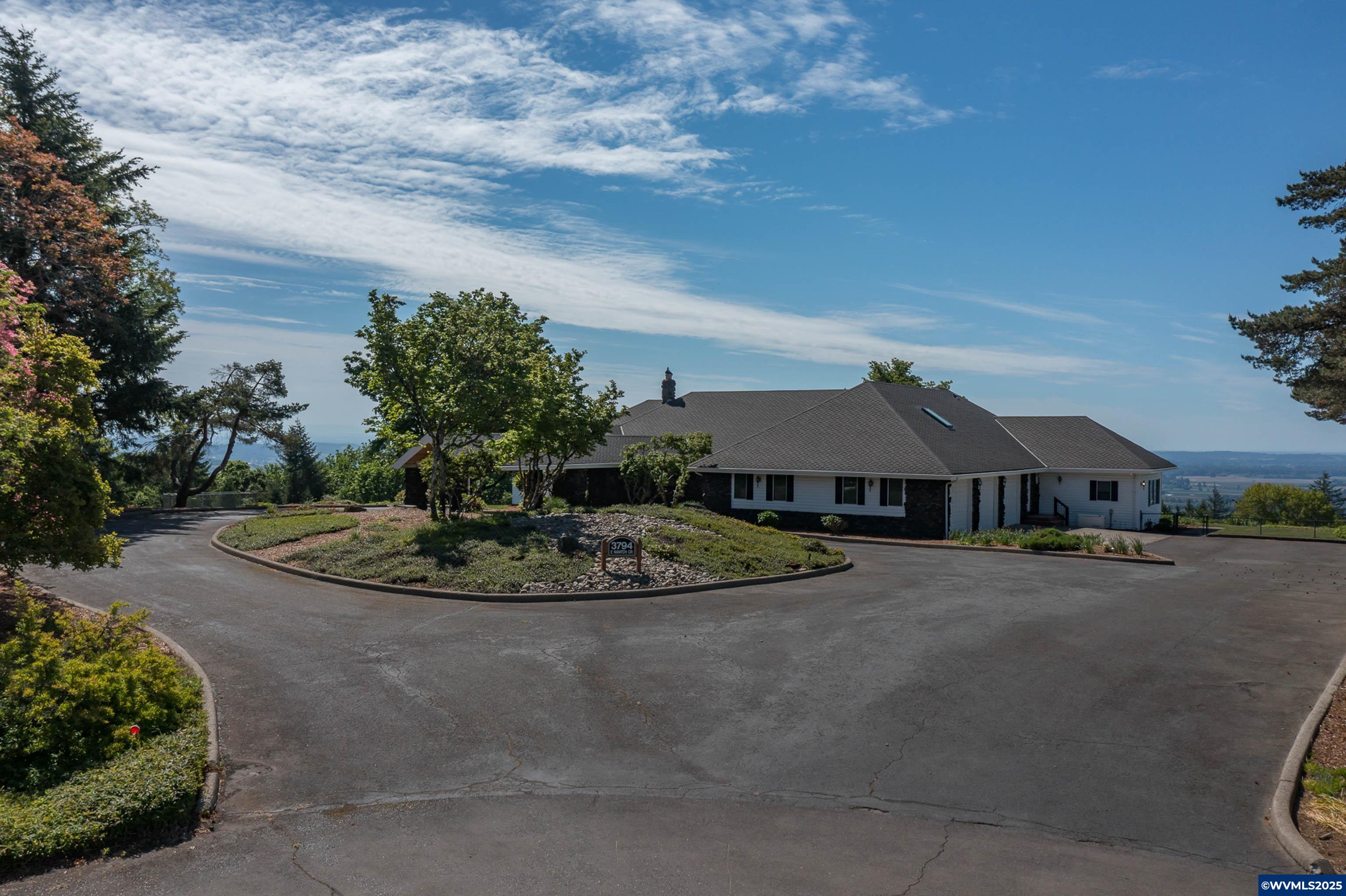 Chinook Estates, built in 1978, HOA $375 per year. 5.82 acres, includes vegetable garden area. Unparalleled 180 degree views of Cascades, Coast Range, Willamette River & beautiful valley below. Apx. 5379 SF, 4 bds, 4 full & 2 half baths, magnificent turret rm, huge bonus/game/theater/exercise rm or possible separate living area with full bath. Large, private office. All the quality you would expect, stone, hardwood, tile & carpet. Expansive decks with magnificent views. Up to 6 car garage & separate shop.