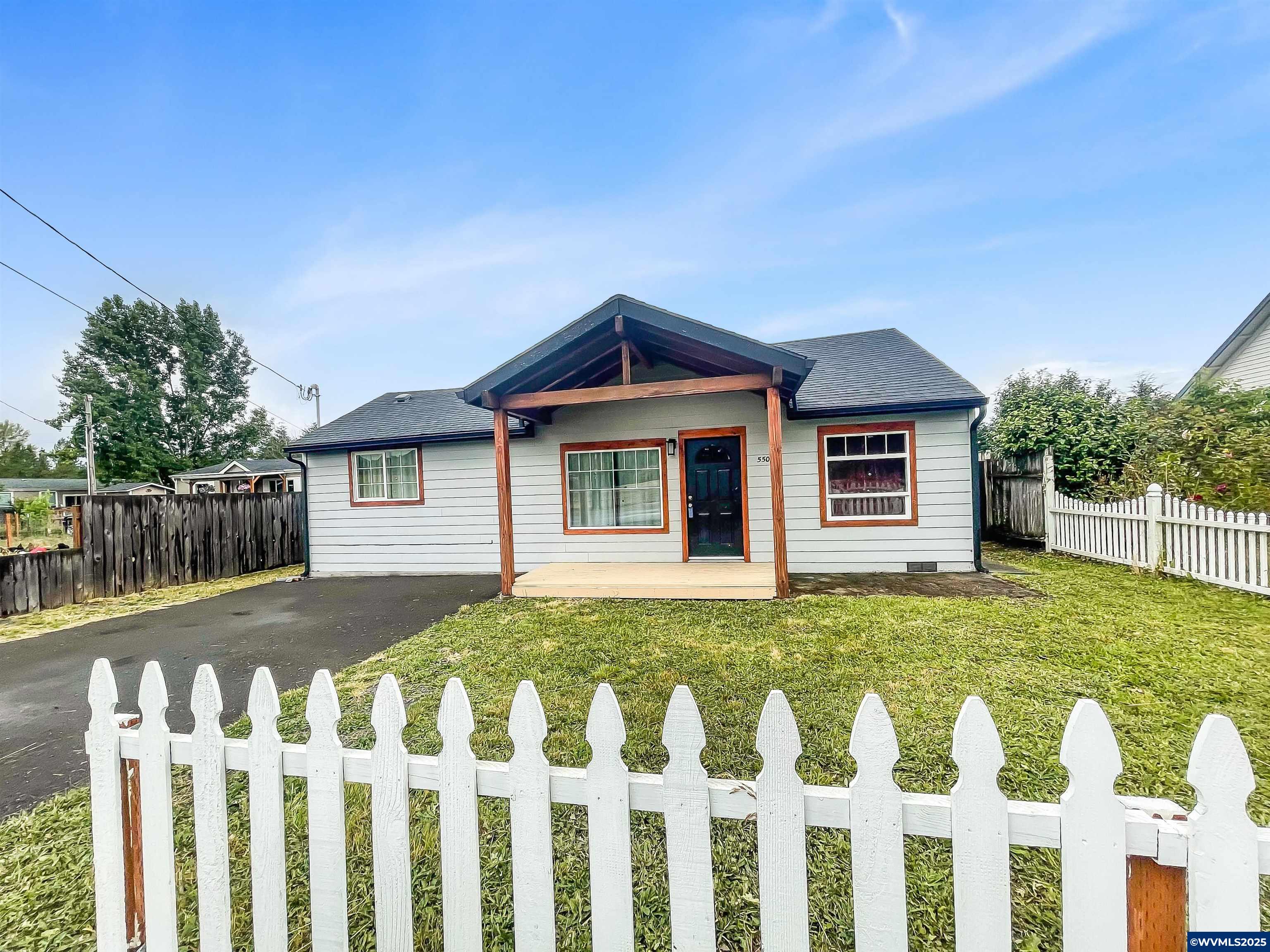 Peaceful, practical, & packed with value! Well-maintained home on nearly 1/4 acre! Huge back yard! Remodeled in 2019 with granite counters, tile backsplash, updated electric, plumbing, siding, roof & more. Just under 900 sq ft with a fenced yard, large covered back porch and covered front porch, storage shed, well & septic for lower utility costs. Enjoy peaceful country living on the outskirts of town yet approximately only 5 minutes to town. Clean, comfortable, and move-in ready with plenty of charm!
