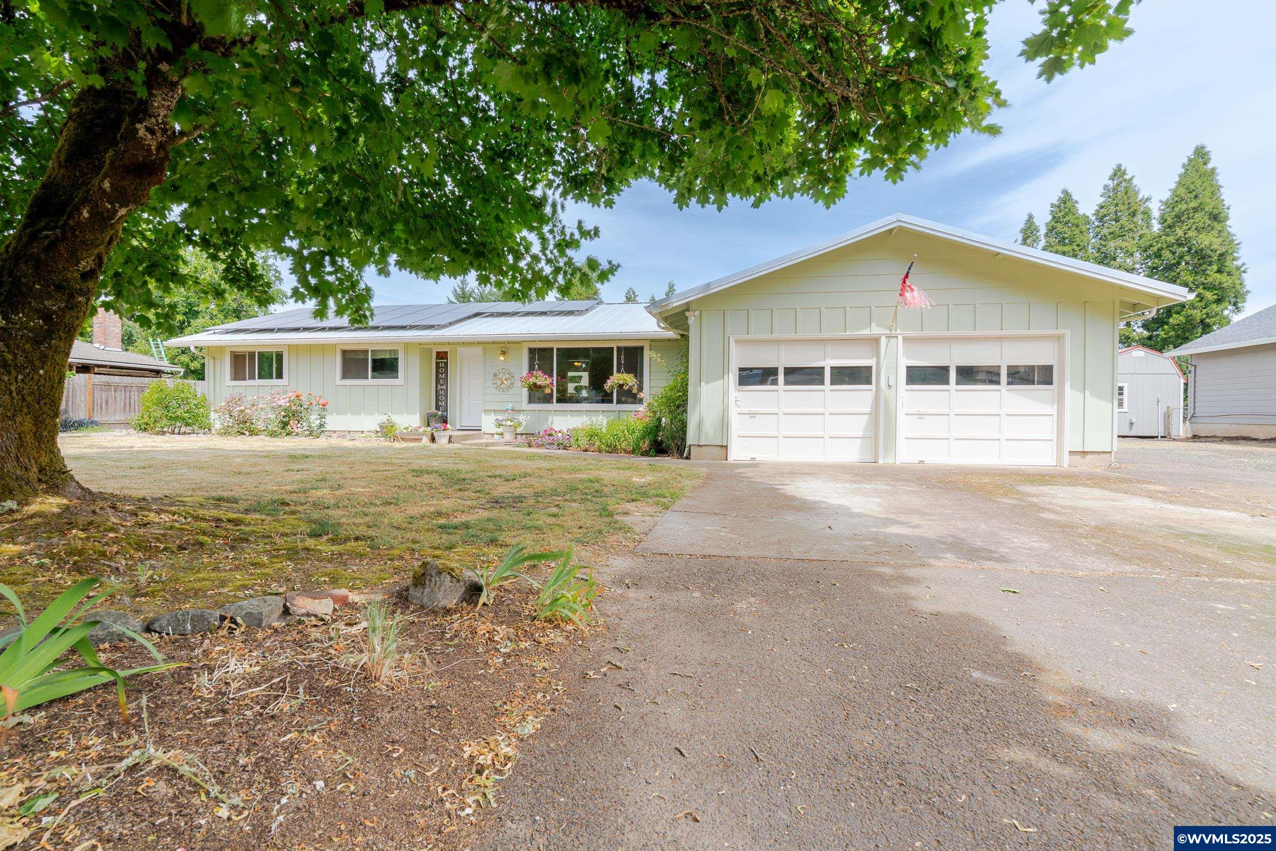 Wonderful rural setting just 3 miles from town with easy access to golf course and bike paths. Situated in the Corvallis School District with Linn county taxes, this spacious, single level home features an updated kitchen open to the dining and family rooms, and a cozy wood fireplace. The lovely backyard includes mature landscaping w/fruit trees, raised beds, underground sprinklers, RV parking, a 20x40  shop, covered patio and a shed for all of your gardening tools. Also, a tiny home! Come see today!