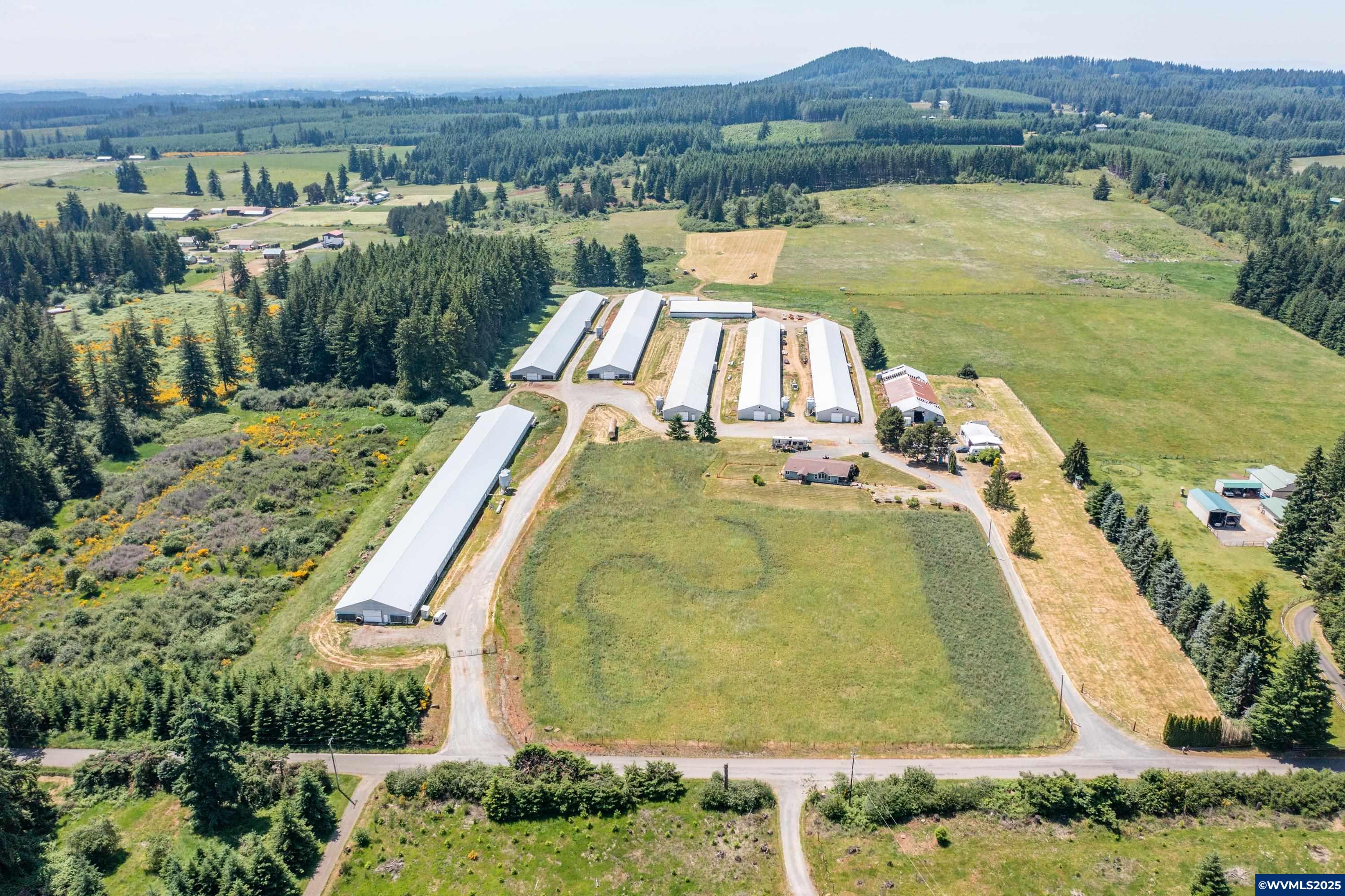 Turnkey poultry operation on 20.97 acres with adjoining 59.66 Ac buildable Measure 49 property predominately Jory soils, giving great opportunity to expand the operation. 6 Broiler barns & Active CAFO. The property includes approximately 164,000 sq ft of outbuildings—all individually metered, alarmed, and temperature controlled. Additional infrastructure includes a manure shed, multiple storage buildings, a workshop, and an on-site office. 4bd, 2ba manufactured home provides comfortable living.
