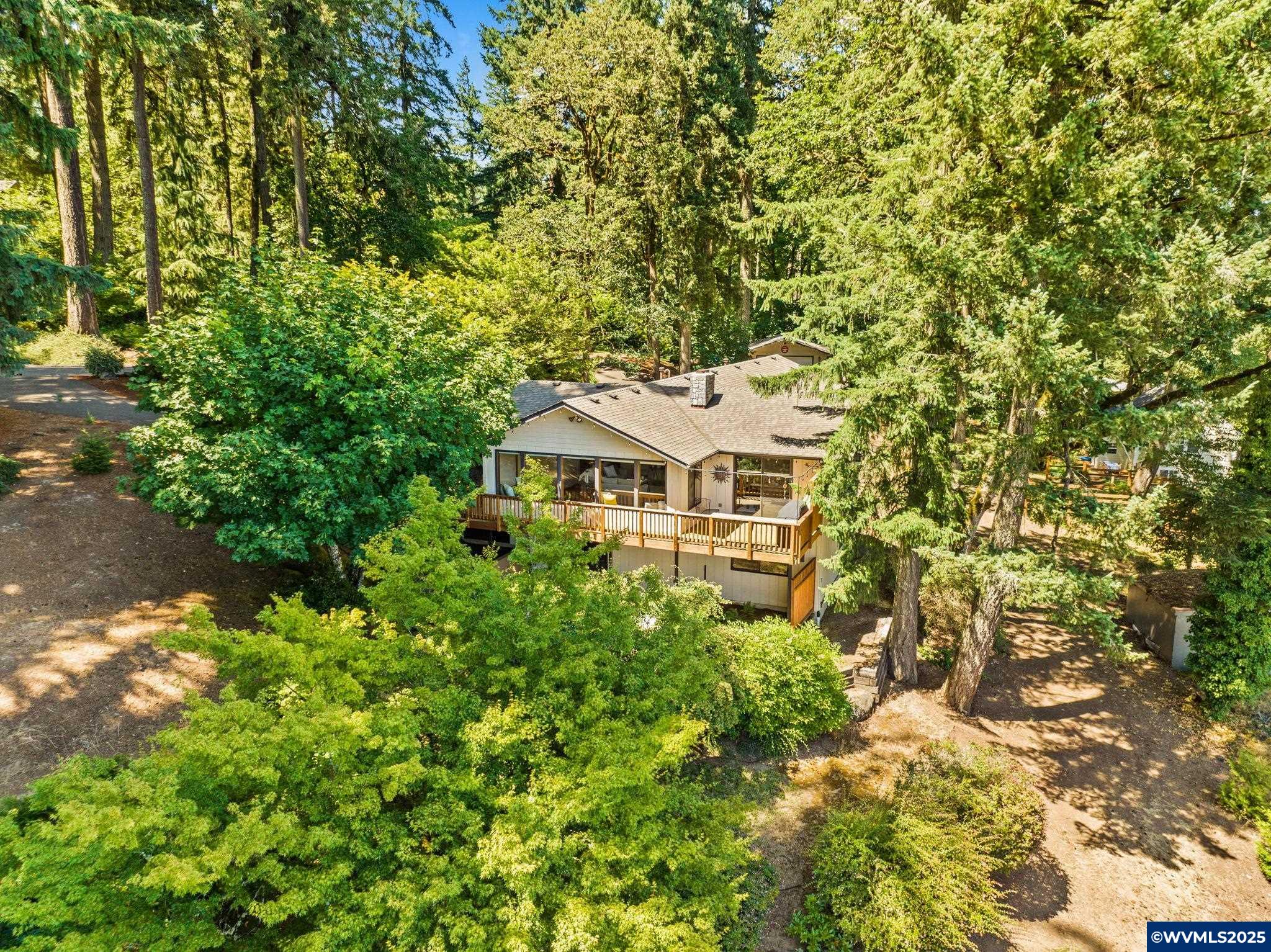 This custom-built, one-owner home offers 4 bedrooms, 3 full baths, and 2 half baths across 2,616 sqft. Thoughtfully designed with the primary ensuite bedrooms on the main. Nestled on 1.10 park-like acres in a quiet cul-de-sac, you'll enjoy peace, privacy, and stunning views through large, light-filled windows. Spacious 24x50 shop and extra RV/boat parking. Convenient location with just a short drive to local schools and the hospital.