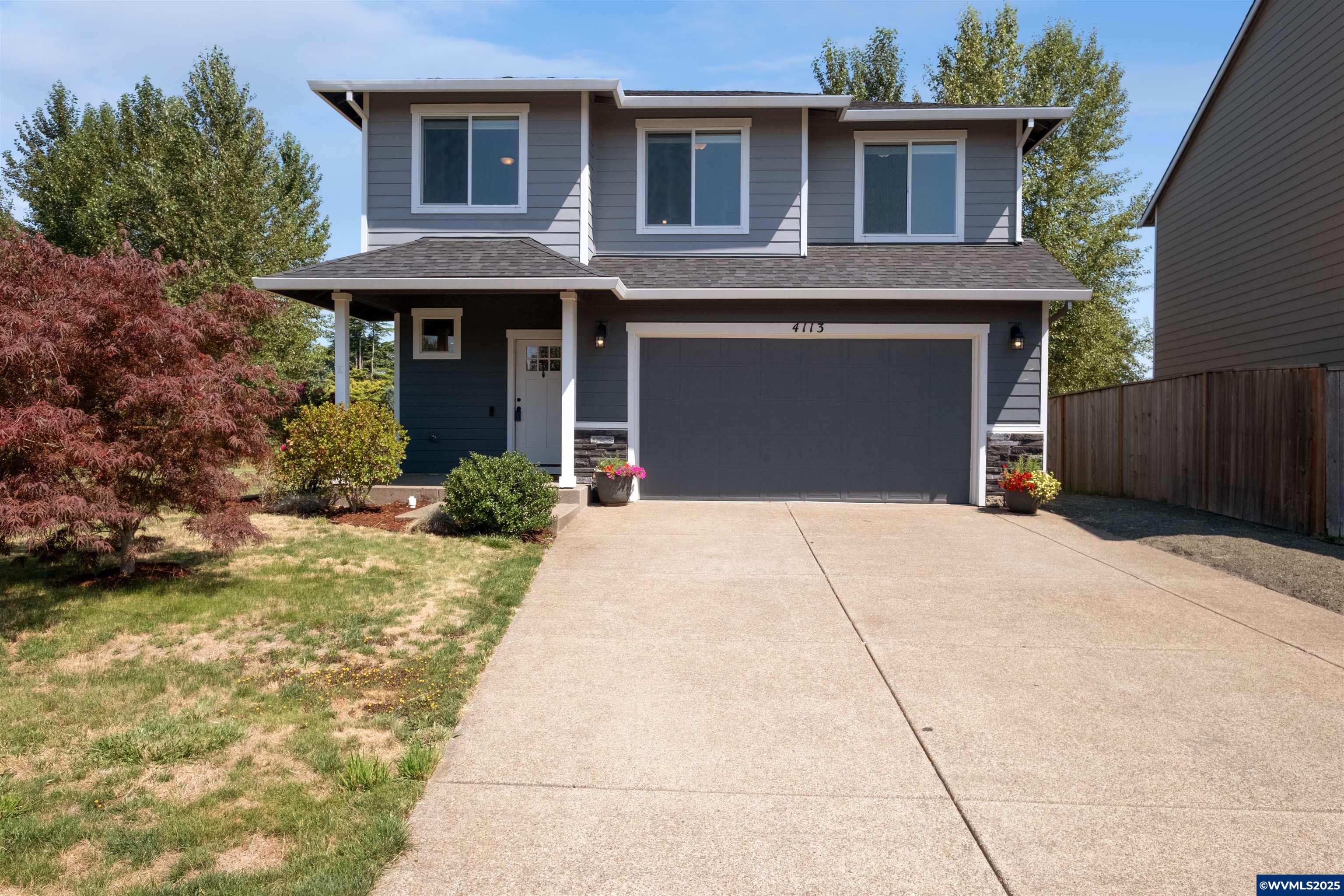 Welcome to this beautifully maintained 4 bed, 2.5 bath home built in 2018, offering 1,881 SF of stylish living space in NE Albany. The open layout features granite countertops, custom cabinetry, and cozy gas fireplace. Step onto the covered patio and enjoy serene views of the protected wetland - no back neighborhoods! With a large primary suite, upstairs laundry, and fully landscaped .28 acre lot, this home has it all - just minutes from schools and parks.