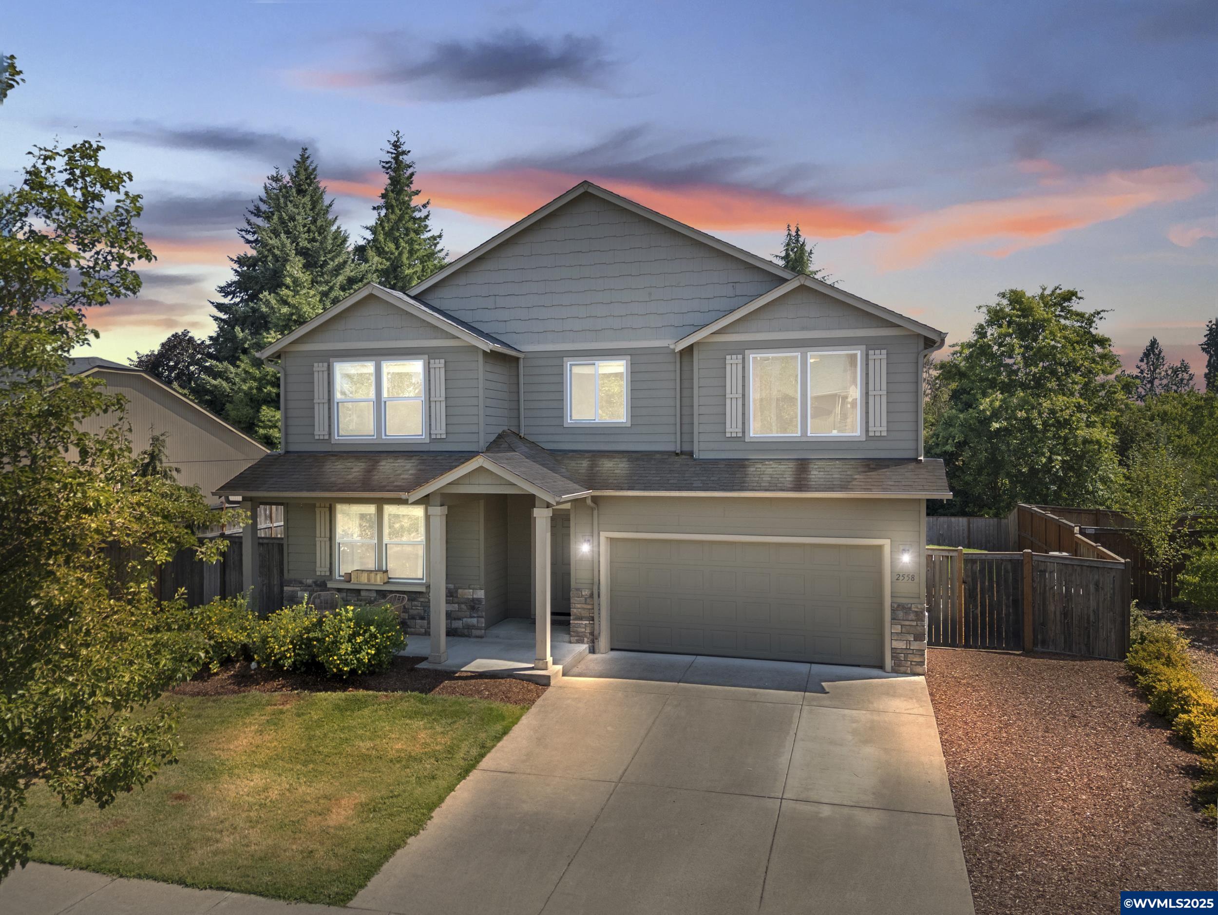 Welcome to this stunning updated home with designer touches & spacious layout! This 5-bedroom, 3-bath home offering 3,236 sq. ft. of thoughtfully designed living space was built in 2014 and has been meticulously upgraded to combine modern comforts with timeless craftsmanship.Step inside to discover custom wood finishings, brand-new flooring throughout, and fresh interior paint. The heart of the home is the show-stopping, floor-to-ceiling stone fireplace — a dramatic two-sided feature shared between the family room and dining area, perfect for cozy gatherings and elegant entertaining.Ideal for multi-generational living or guests, the main level includes a bedroom and full bathroom. Upstairs, you’ll find a spacious loft or flex space, ideal for a media room, home office, or play area.Additional upgrades include all-new baseboards, trim, light fixtures, window coverings, and new carpet. Enjoy peace of mind with a brand-new water heater and a recently installed dishwasher (only 1 year old).Step outside to your freshly landscaped backyard with irrigation, ready for summer fun! A gas line is already installed for a fire pit or outdoor grill — perfect for entertaining under the stars.This turnkey home offers comfort, style, and space — all that’s missing is you!
