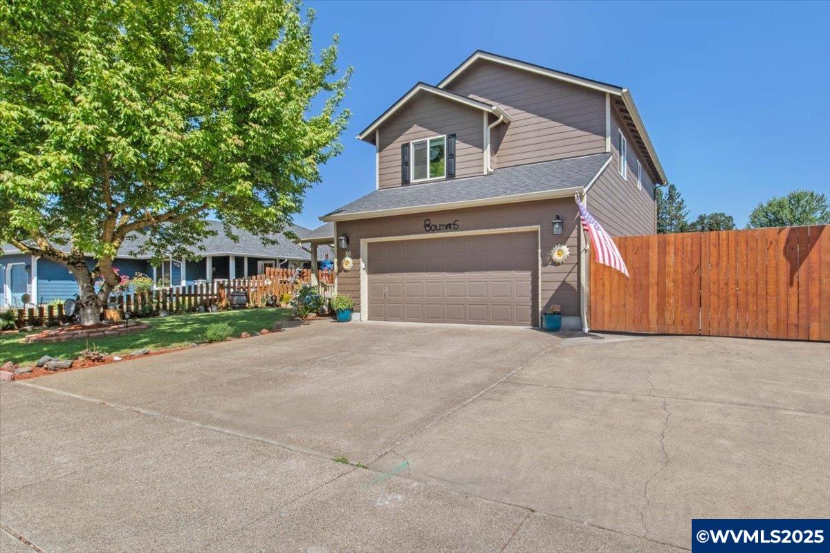 This beautifully maintained home offers the ideal combination of comfort, functionality, and outdoor living. Featuring 3 bedrooms, 2.5 bathrooms, and a 2-car garage. Enjoy central A/C, a cozy fireplace on cool evenings and a layout that flows effortlessly. Step outside to your fully fenced backyard—your own private oasis—complete with UG sprinklers and a hot tub. The spacious deck is ideal for entertaining or simply enjoying the peaceful surroundings. The backyard is thoughtfully equipped with a shed featuring a loft and electricity, perfect for storage or hobbies. Need RV parking? You’ve got it—complete with a dedicated dump station. This home is truly move-in ready and packed with extras you won’t want to miss.