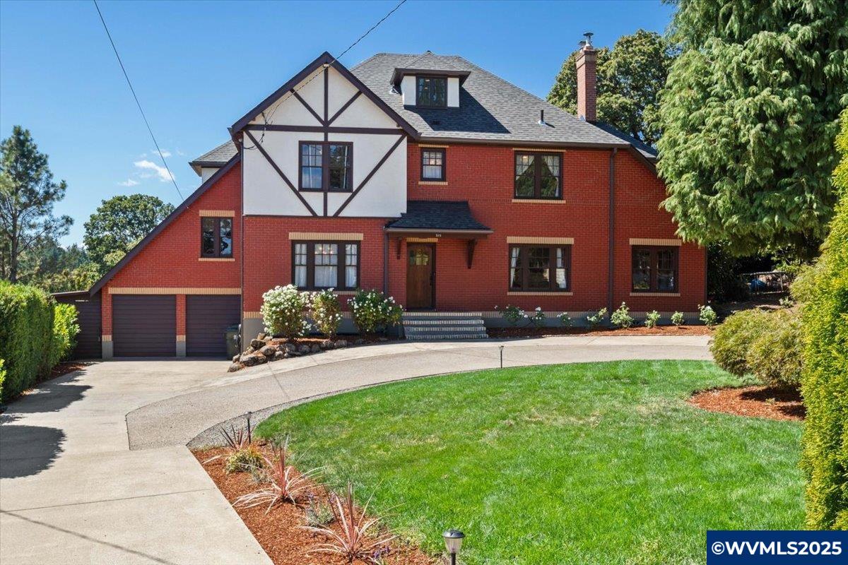 Happy Birthday to this 100 year old classic Tudor home. This home is overflowing with charm and character. It has been loved and it shows. Living room off entry with a functional fireplace and details fitting of a home this era. Study and Formal dining as well as a gourmet kitchen with granite and stainless. Second level has 4br/2ba with another large bedroom on the 3rd level. Full basement if you need more room and other flex spaces available. Pull through drive and large deck and yard for entertaining.